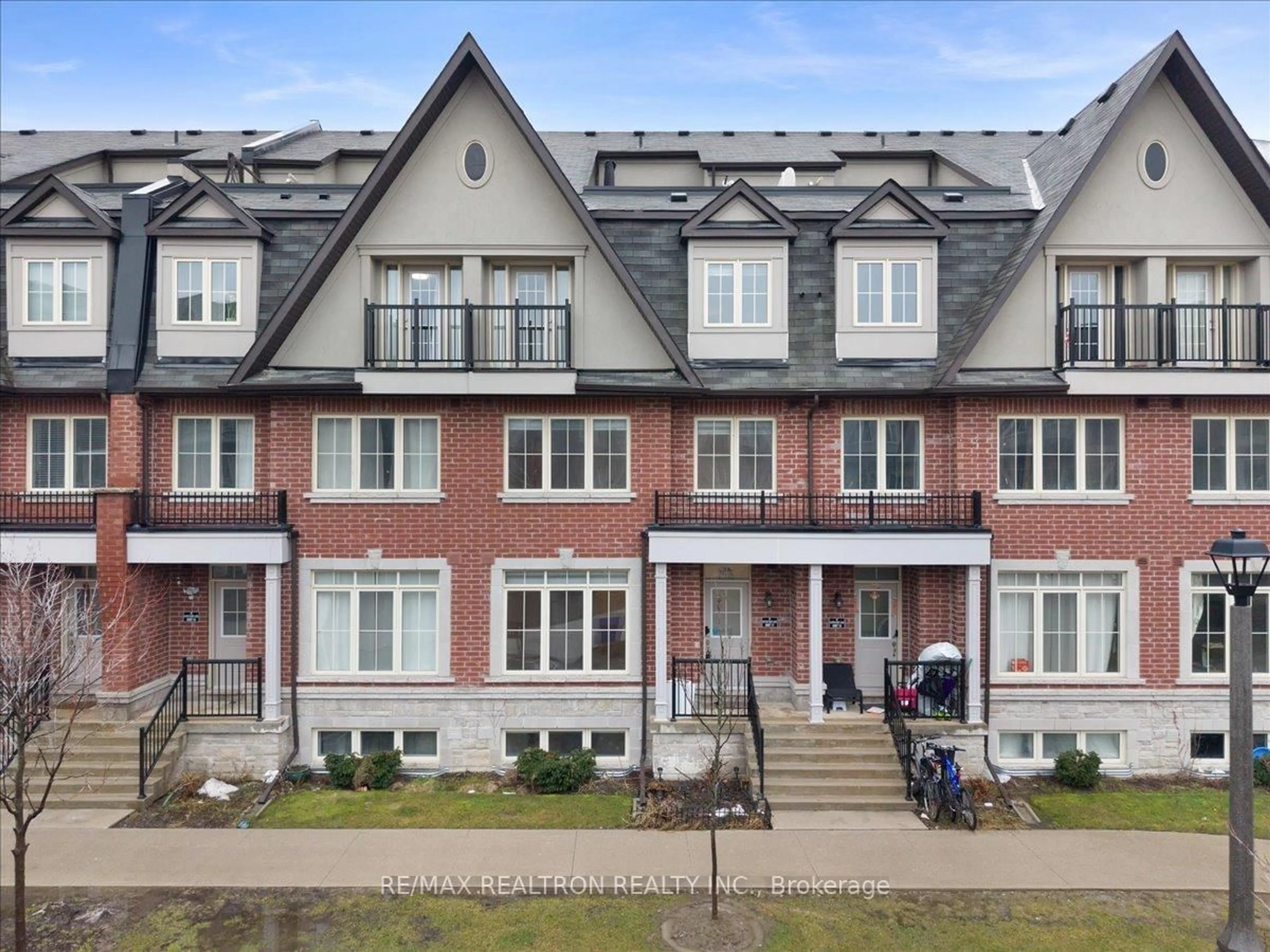 Home with brick exterior material, street for 8 Eaton Park Lane #17, Toronto Ontario M1W 0A5