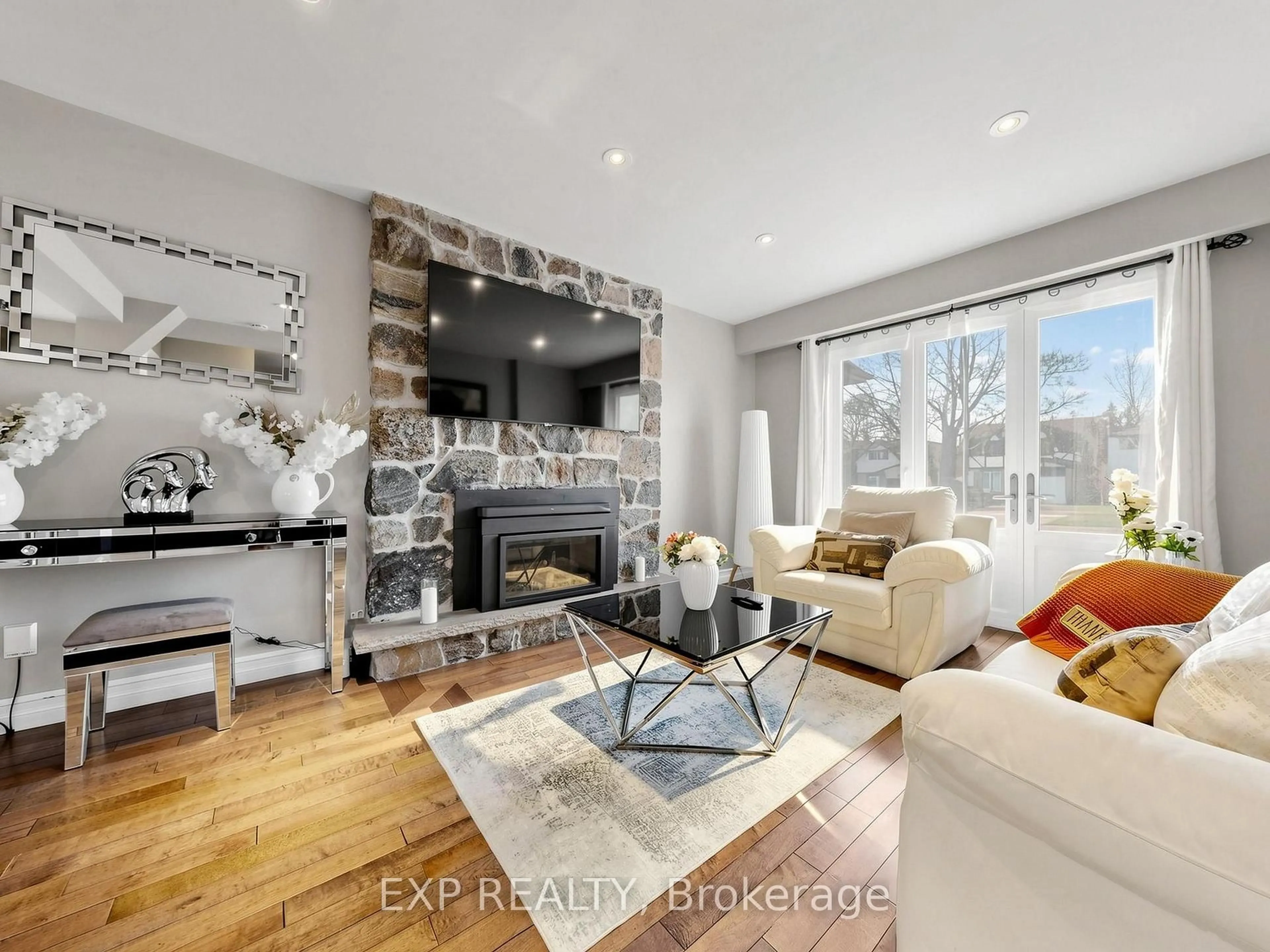 Living room with furniture, wood/laminate floor for 598 Stonebridge Lane, Pickering Ontario L1W 3B3