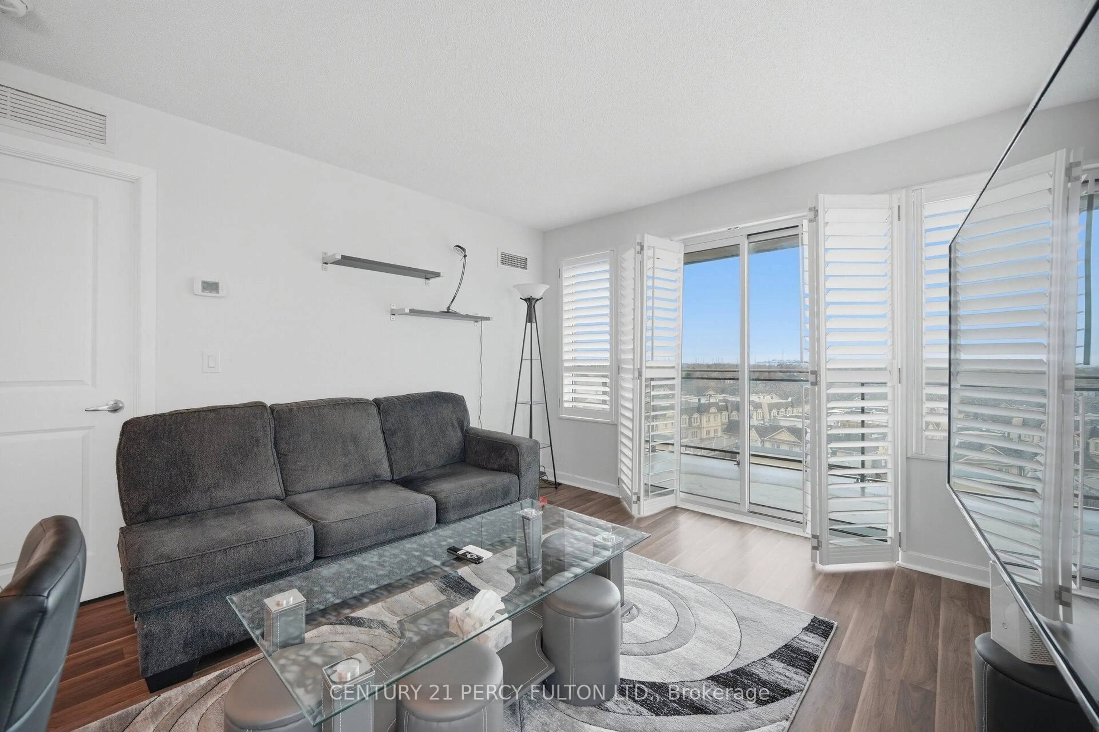 Living room with furniture, wood/laminate floor for 1235 Bayly St #702, Pickering Ontario L1W 1L7