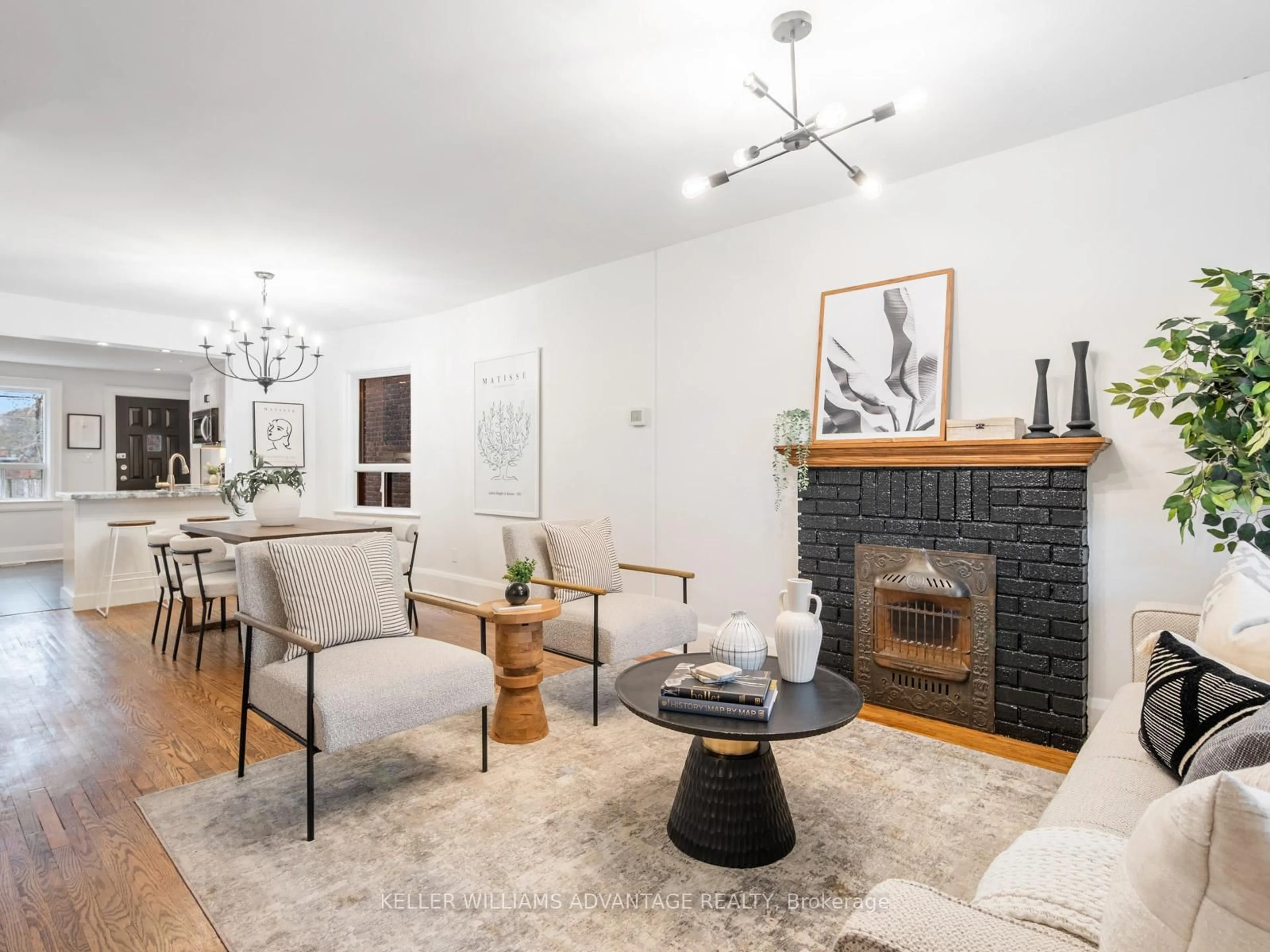 Living room with furniture, wood/laminate floor for 122 Woodfield Rd, Toronto Ontario M4L 2W6