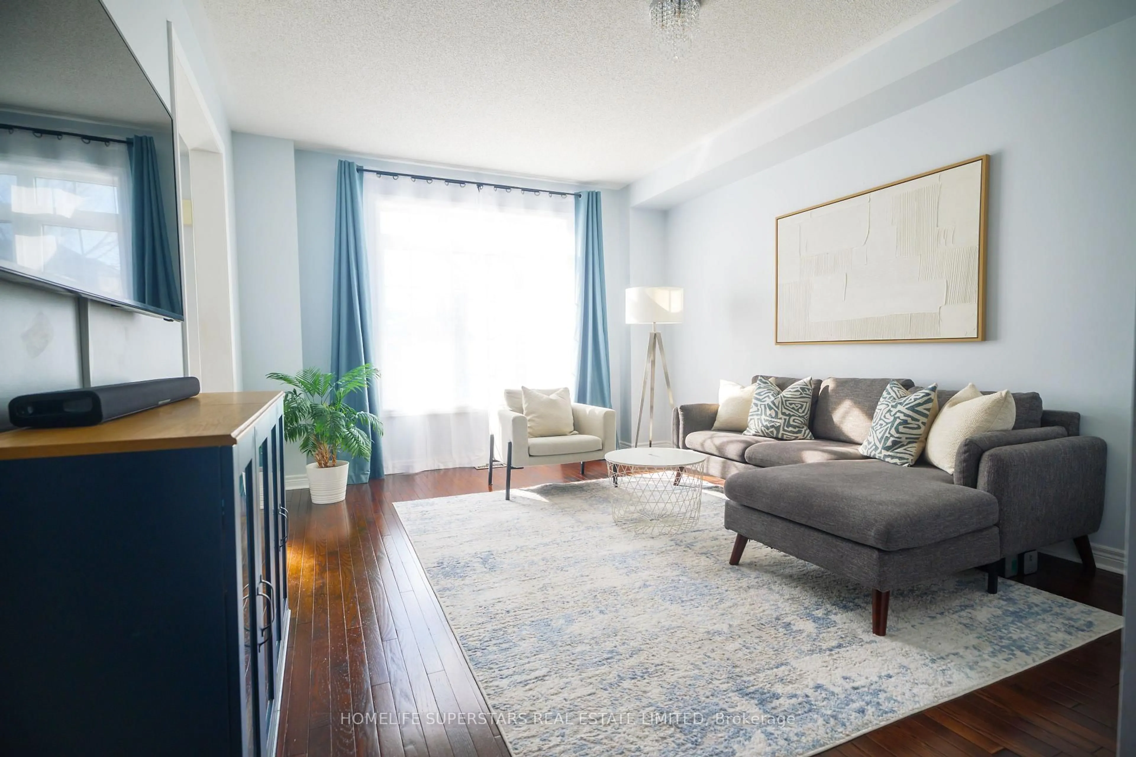Living room with furniture, wood/laminate floor for 2555 Canadian St, Pickering Ontario L1X 0C7