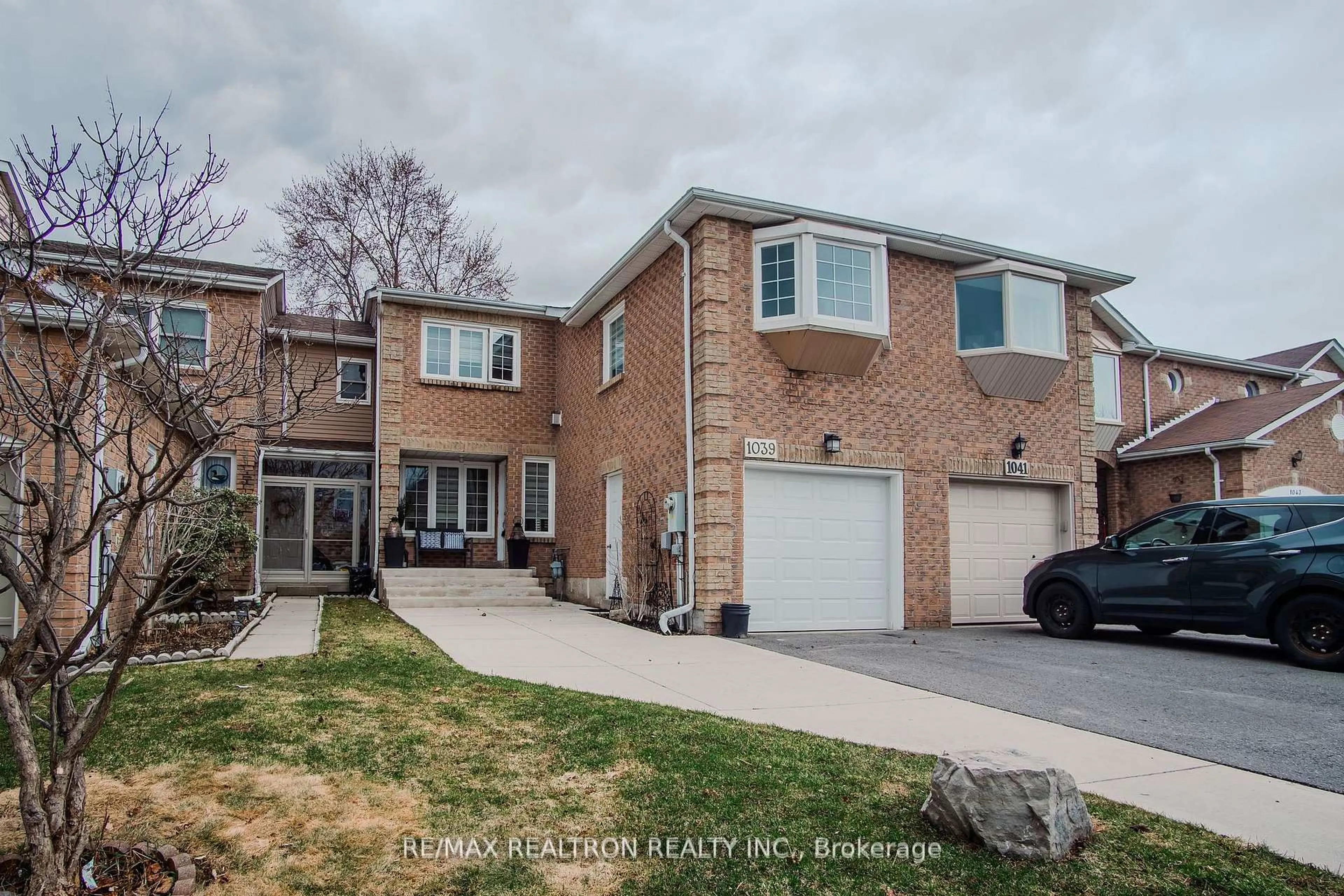 Home with brick exterior material, street for 1039 Rowntree Cres, Pickering Ontario L1V 5A9