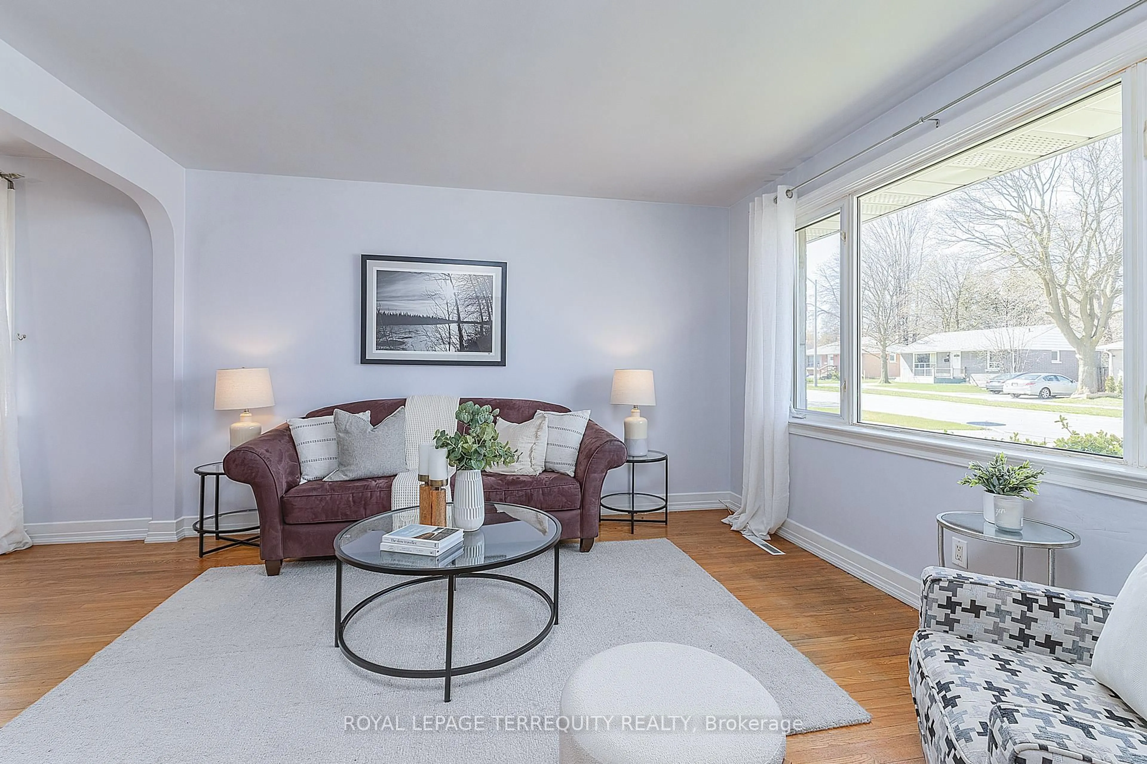 Living room with furniture, wood/laminate floor for 32 Admiral Rd, Ajax Ontario L1S 2N9