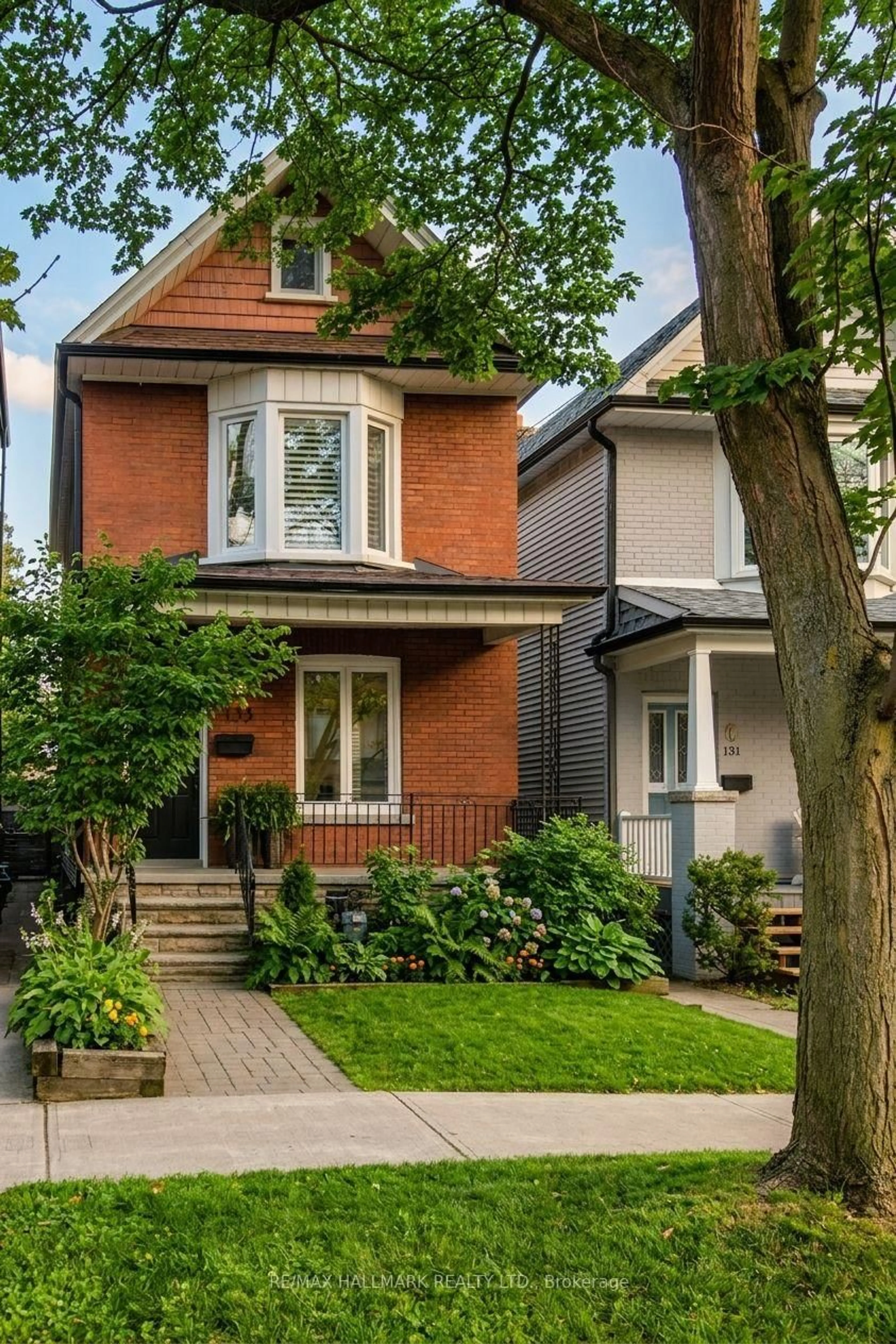 Home with brick exterior material, street for 133 Langford Ave, Toronto Ontario M4J 3E5