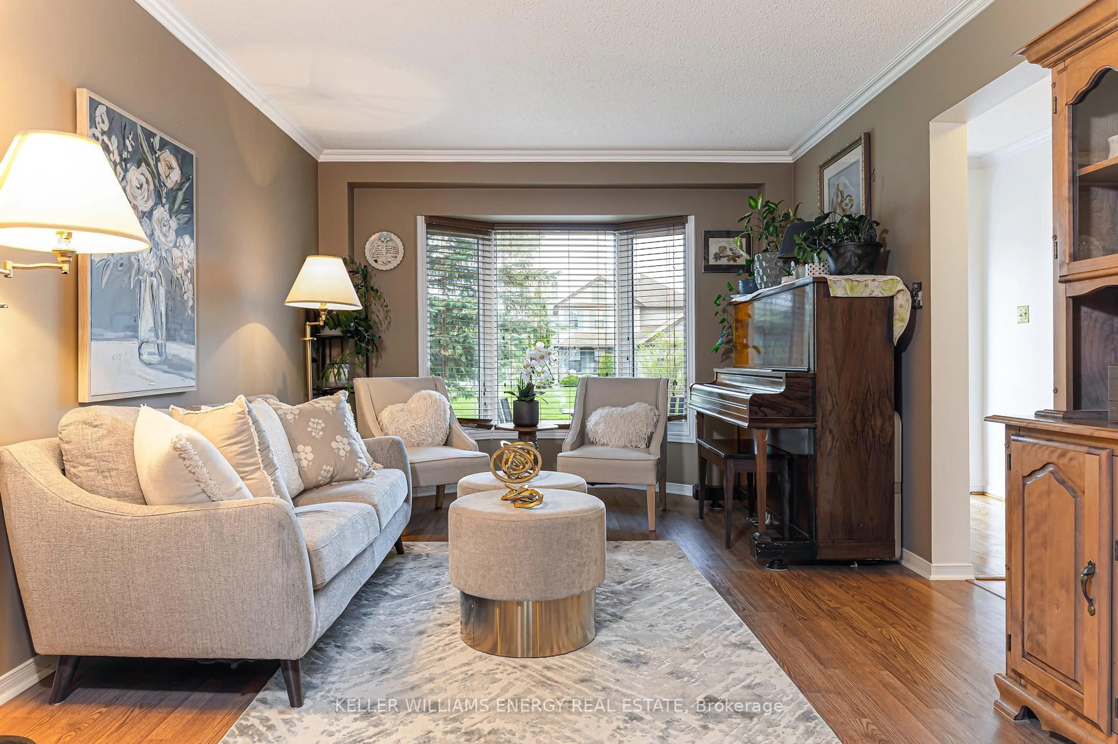 Living room with furniture, wood/laminate floor for 873 Lochness Cres, Oshawa Ontario L1J 7P9