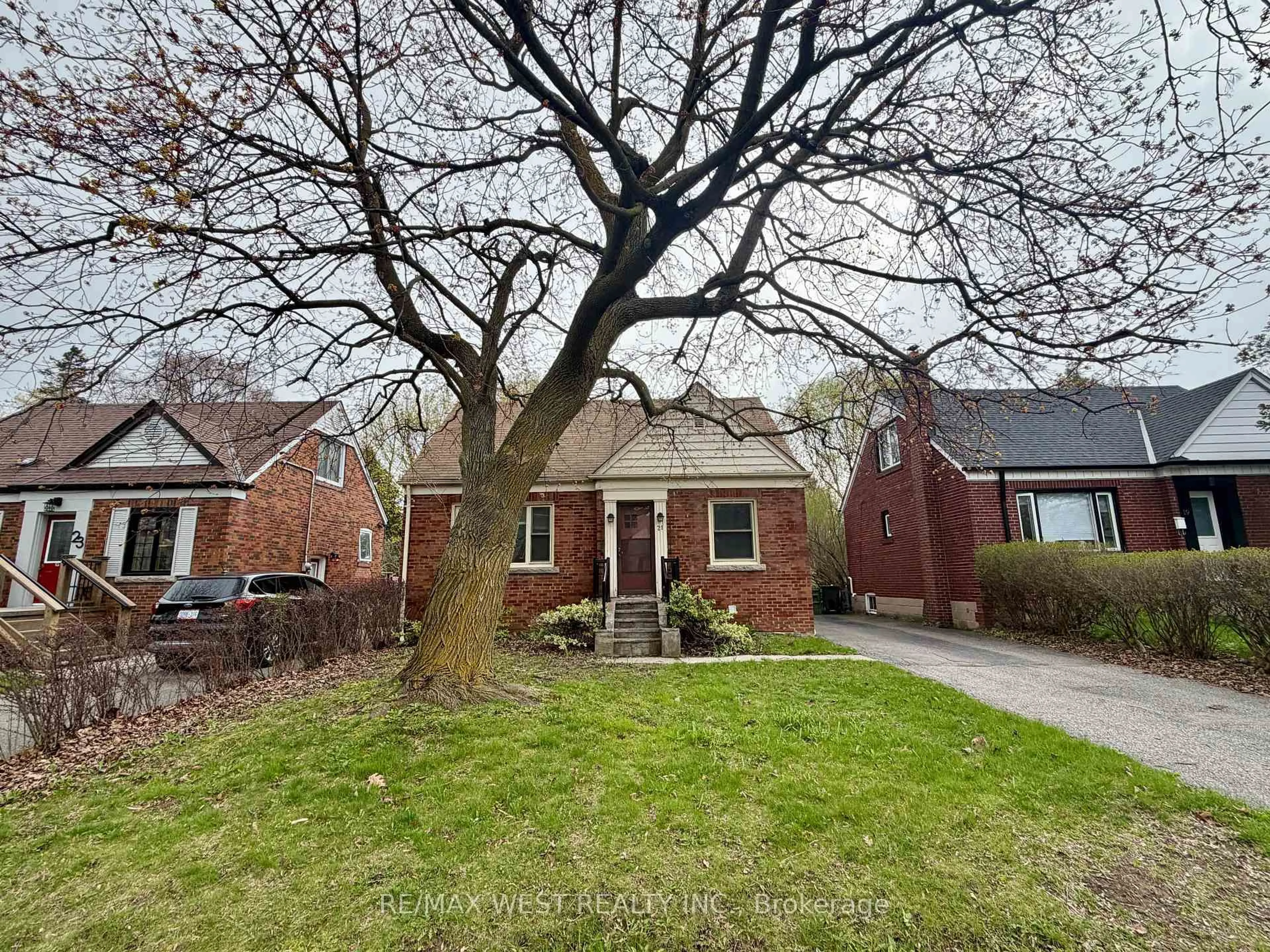 Home with brick exterior material, street for 21 Plaxton Dr, Toronto Ontario M4B 2P6