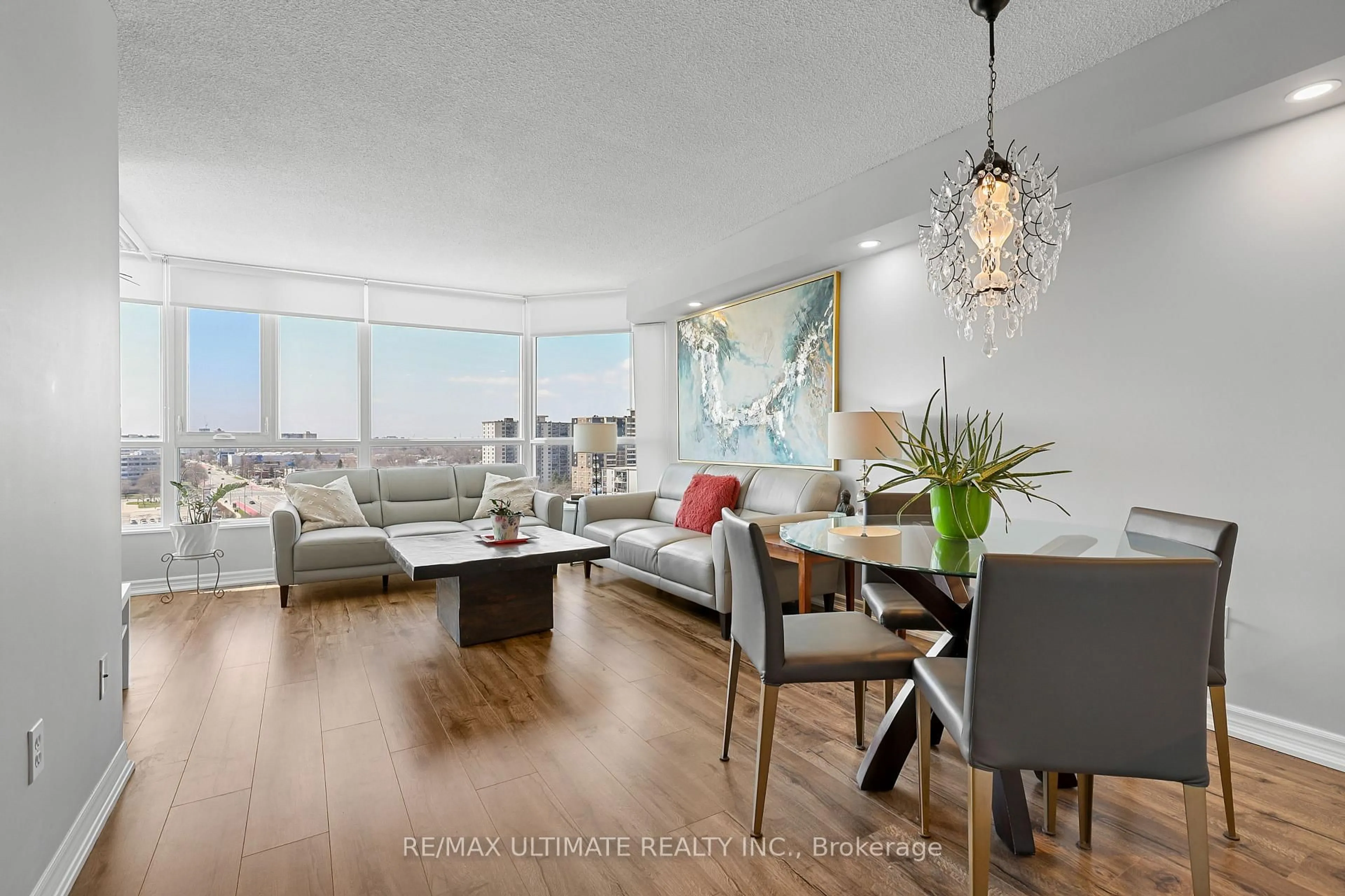 Living room with furniture, wood/laminate floor for 3231 Eglinton Ave #1205B, Toronto Ontario M1J 3N5