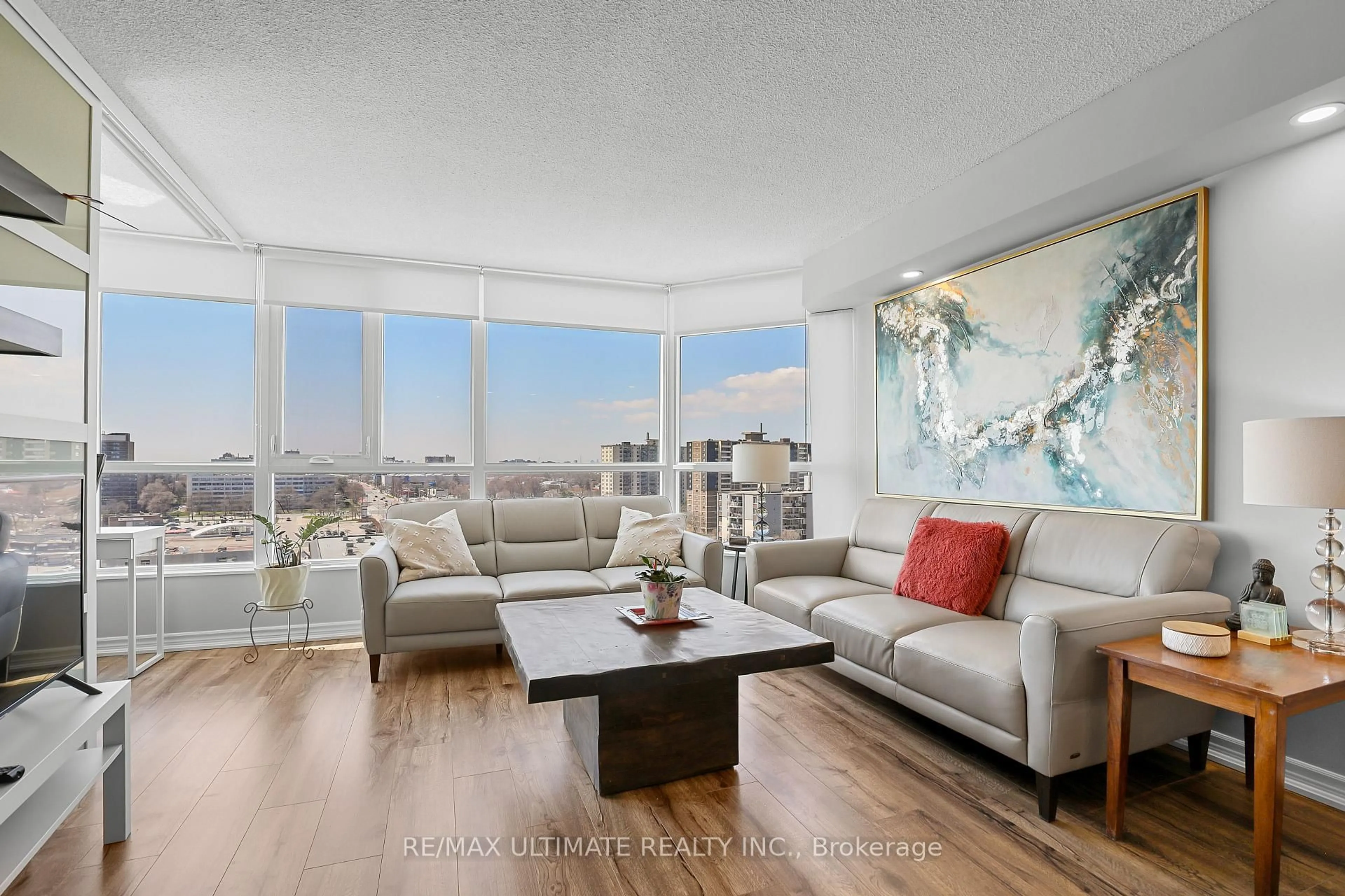 Living room with furniture, wood/laminate floor for 3231 Eglinton Ave #1205B, Toronto Ontario M1J 3N5