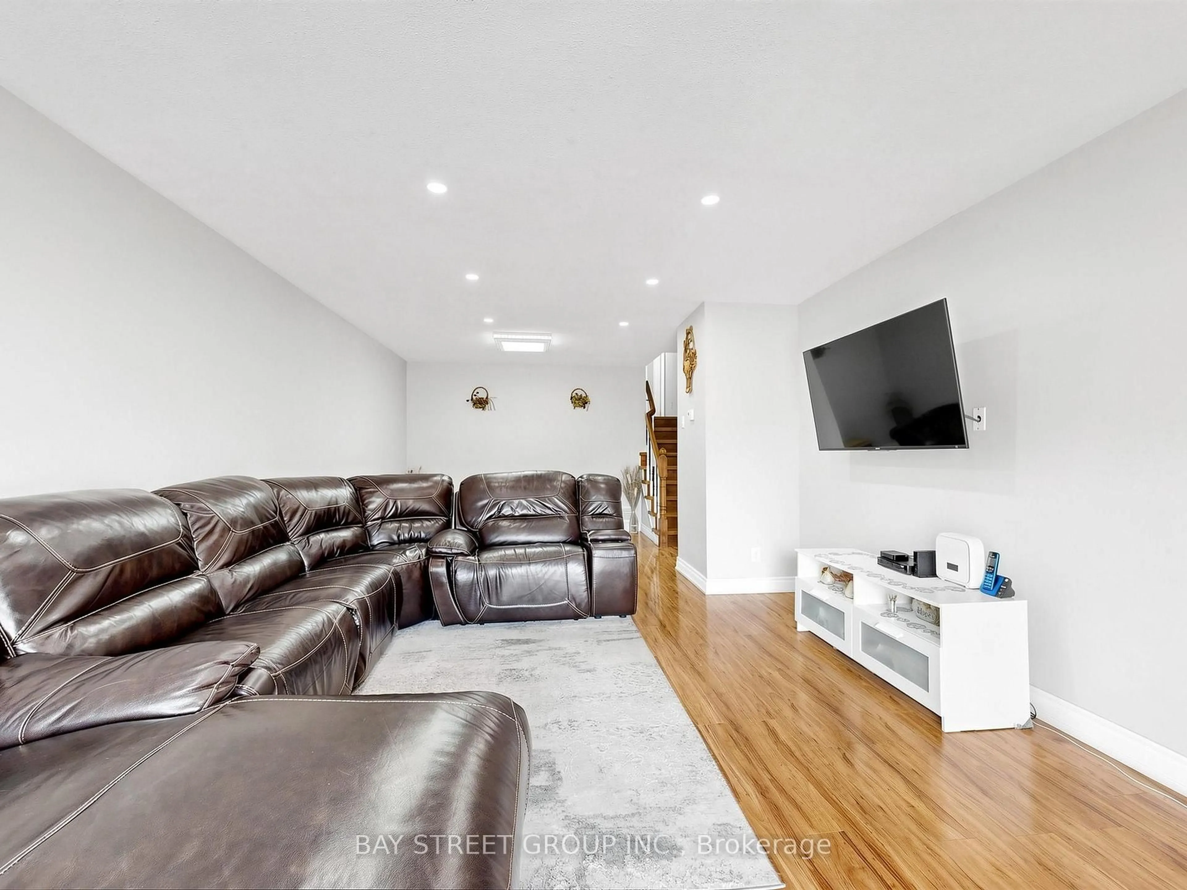 Living room with furniture, wood/laminate floor for 42 Robbinstone Dr, Toronto Ontario M1B 2E6