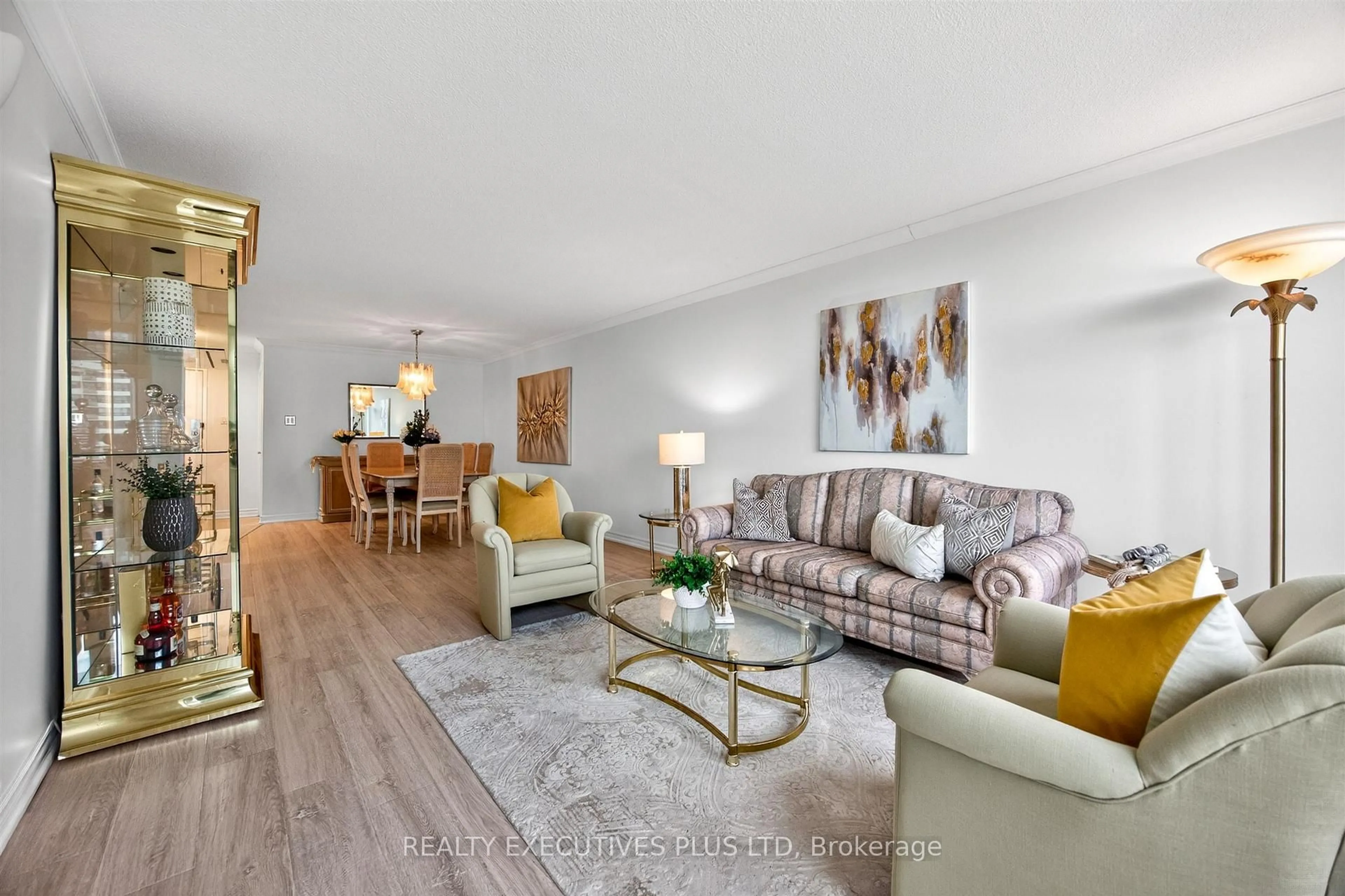Living room with furniture, wood/laminate floor for 55 Huntingdale Blvd #902, Toronto Ontario M1W 2N9