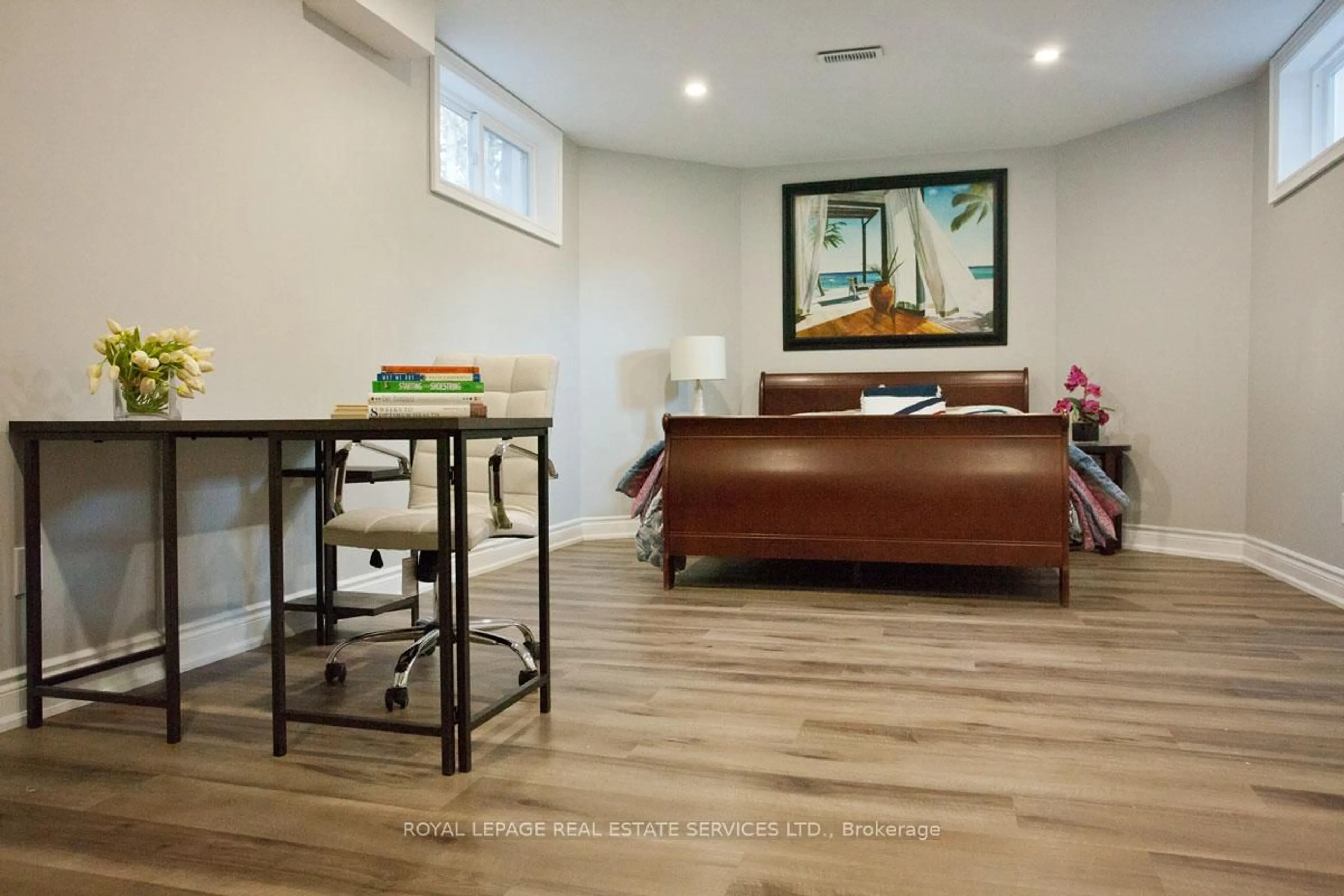 Living room with furniture, wood/laminate floor for 47 Knightsbridge Crt, Whitby Ontario L1R 2T9