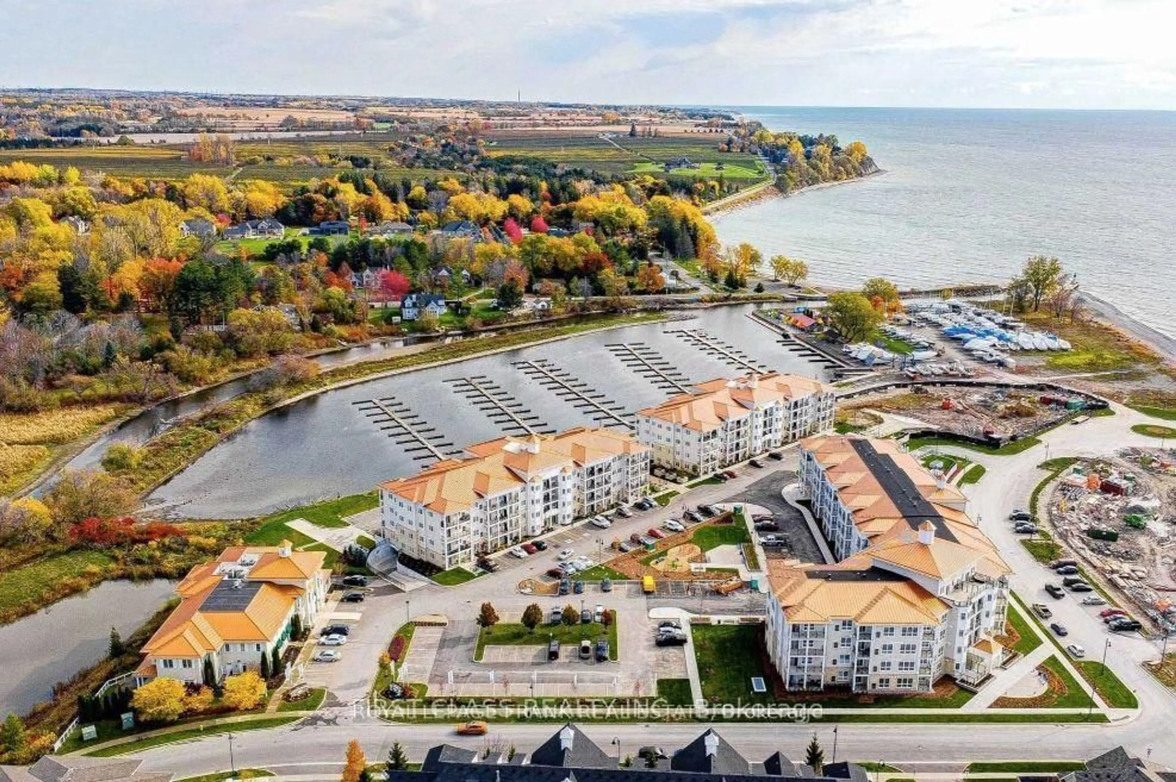 A pic from outside/outdoor area/front of a property/back of a property/a pic from drone, water/lake/river/ocean view for 50 Lakebreeze Dr #317, Clarington Ontario L1B 0V9