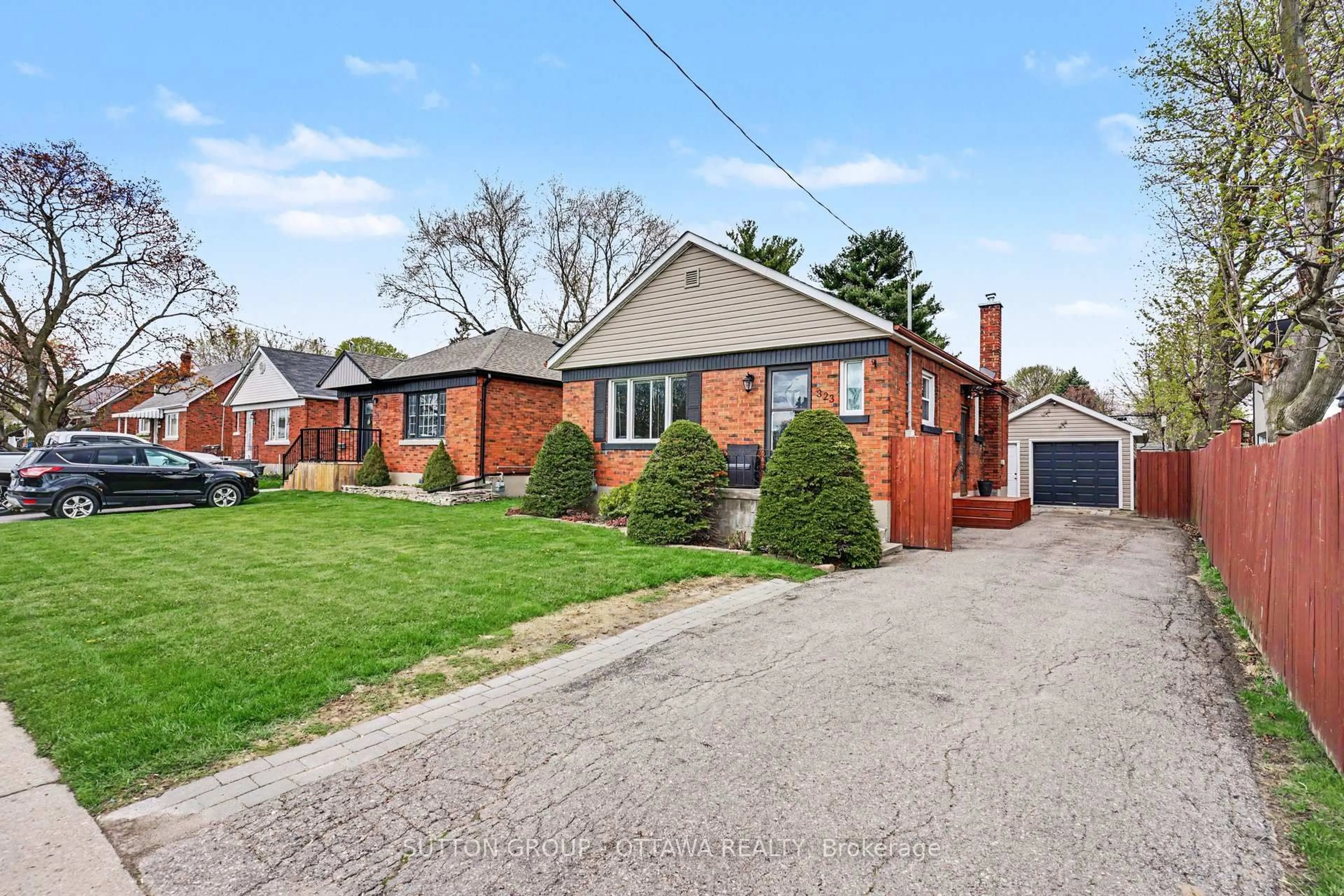 Home with brick exterior material, street for 323 Wilson Rd, Oshawa Ontario L1H 6C4