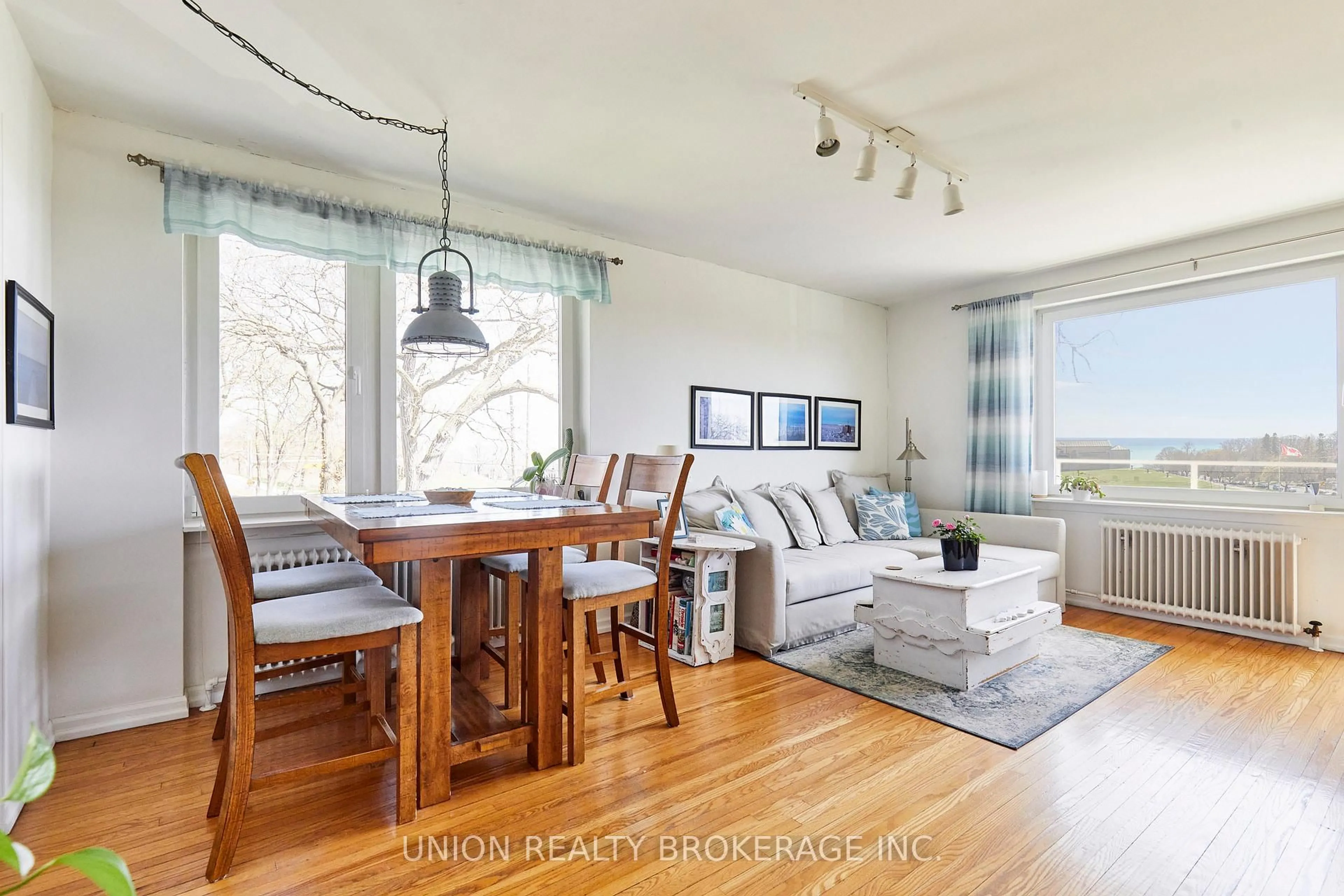 Living room with furniture, wood/laminate floor for 2378 Queen St #8, Toronto Ontario M4E 1H4