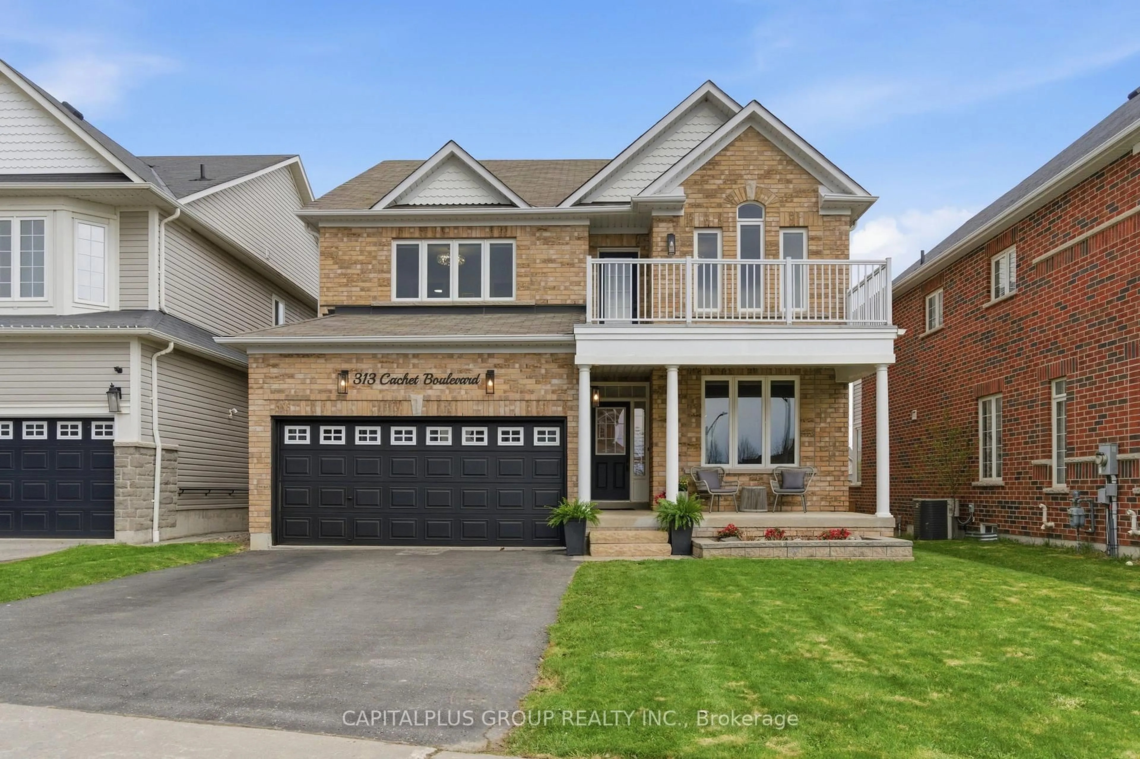 Home with brick exterior material, street for 313 Cachet Blvd, Whitby Ontario L1M 2L9