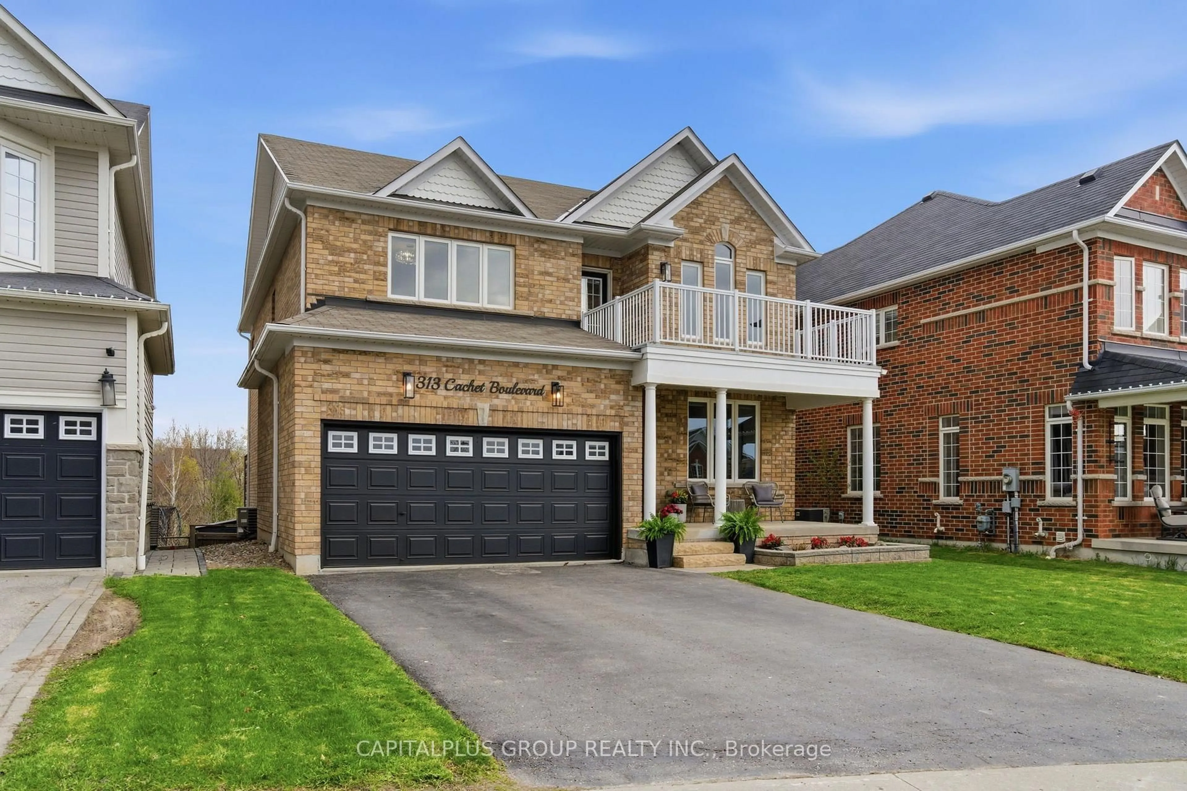 Home with brick exterior material, street for 313 Cachet Blvd, Whitby Ontario L1M 2L9