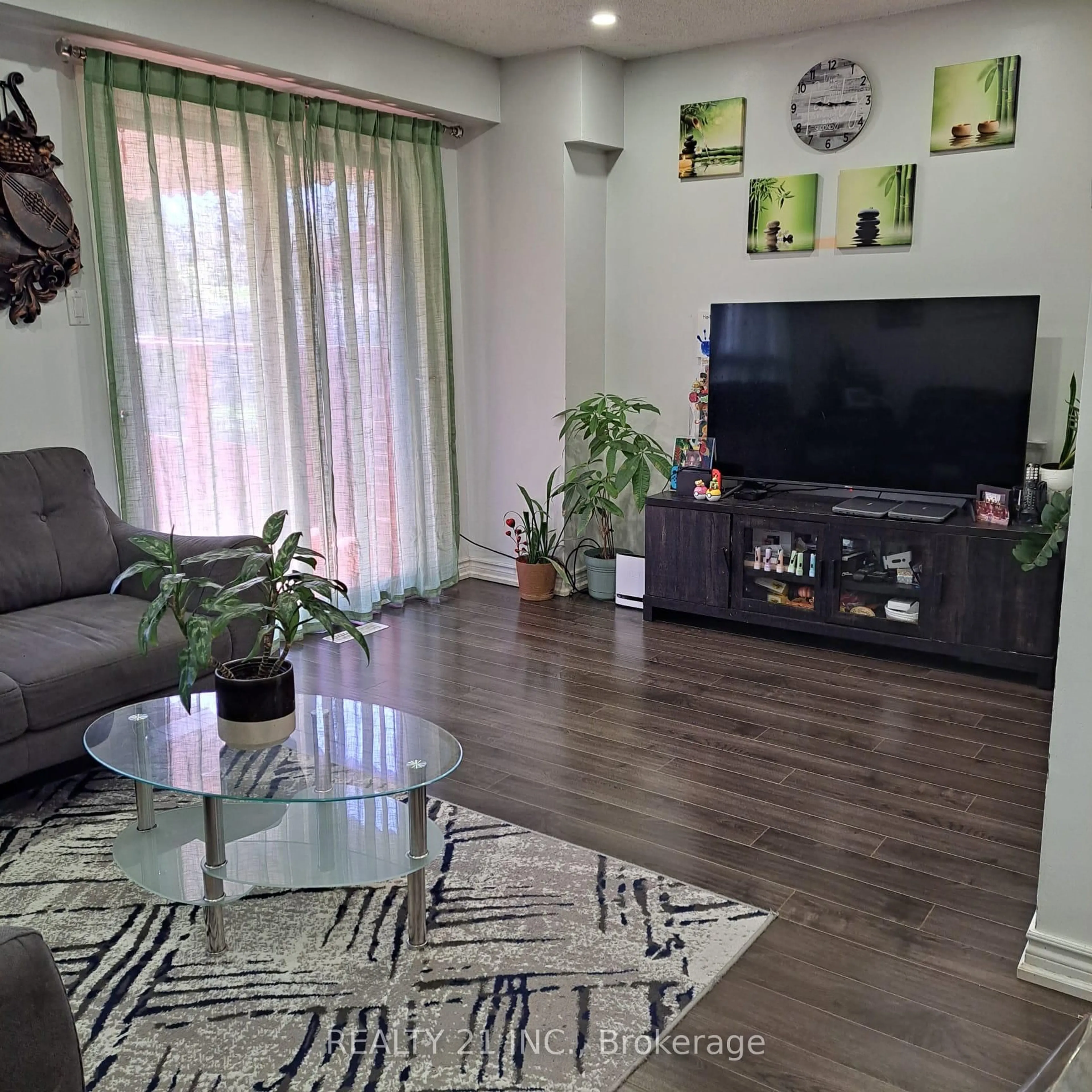 Living room with furniture, wood/laminate floor for 55 Shepmore Terr, Toronto Ontario M1B 3H3