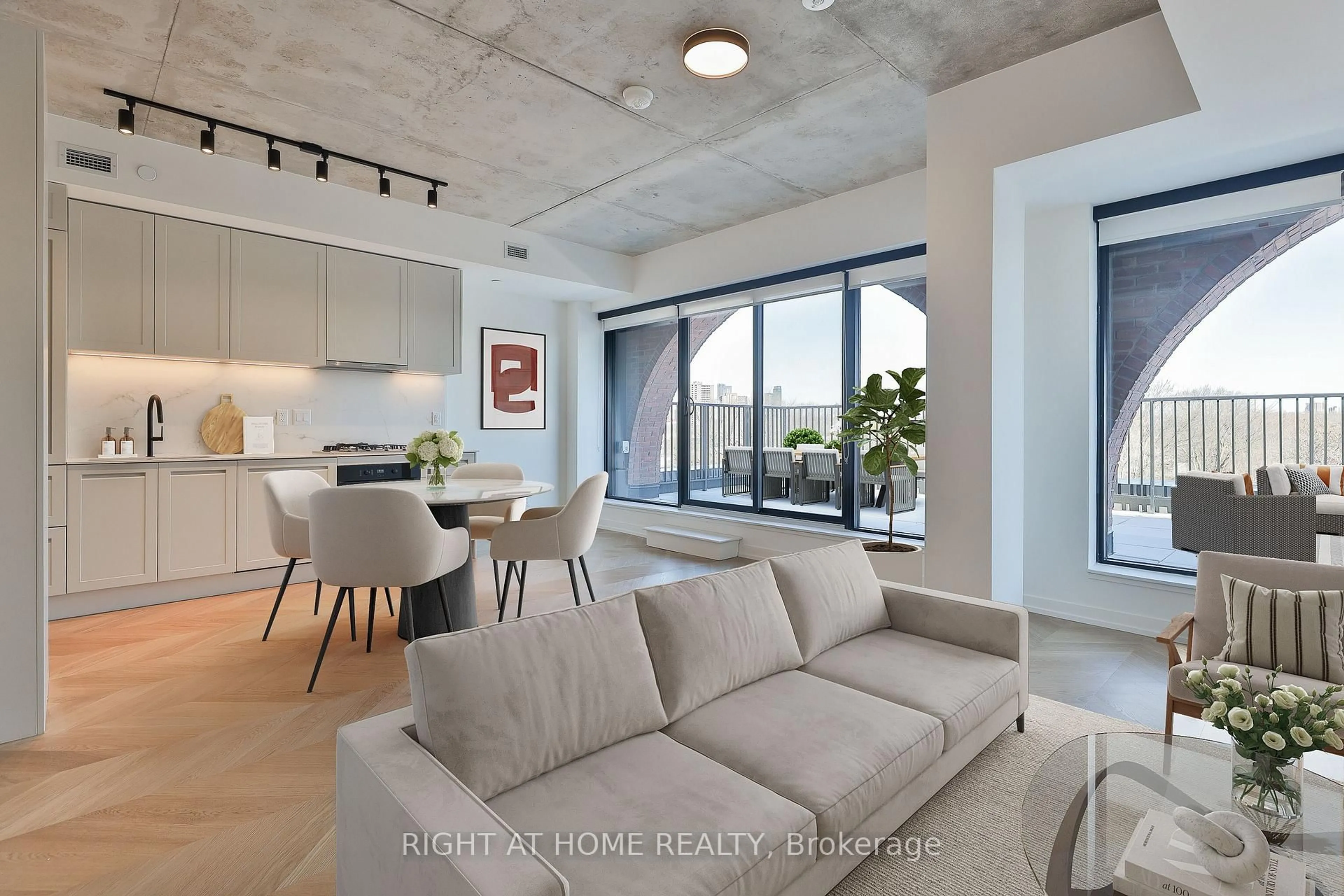 Living room with furniture, cement floor for 761 Queen St #602, Toronto Ontario M4M 1H3