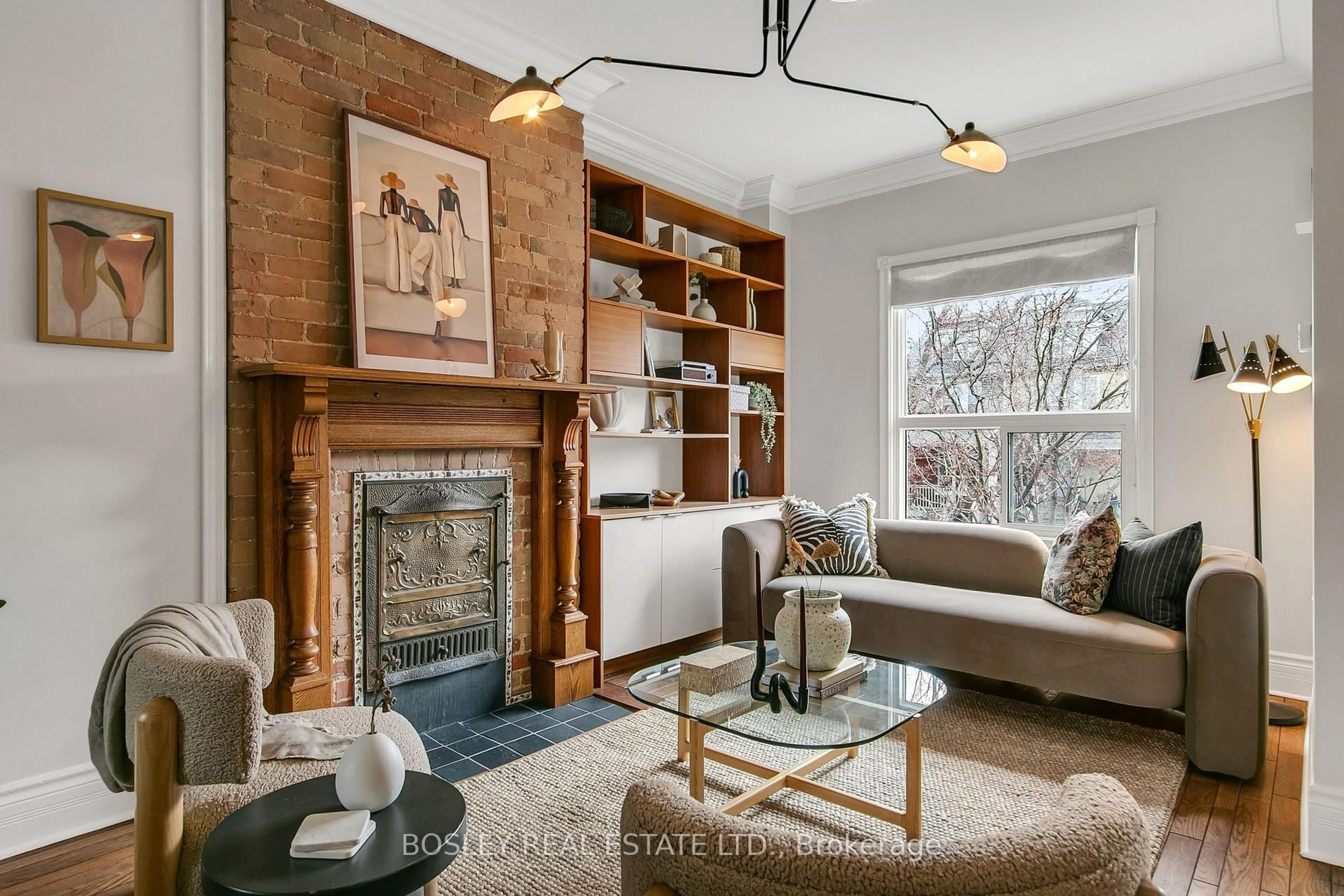 Living room with furniture, wood/laminate floor for 42 Dingwall Ave, Toronto Ontario M4J 1C3