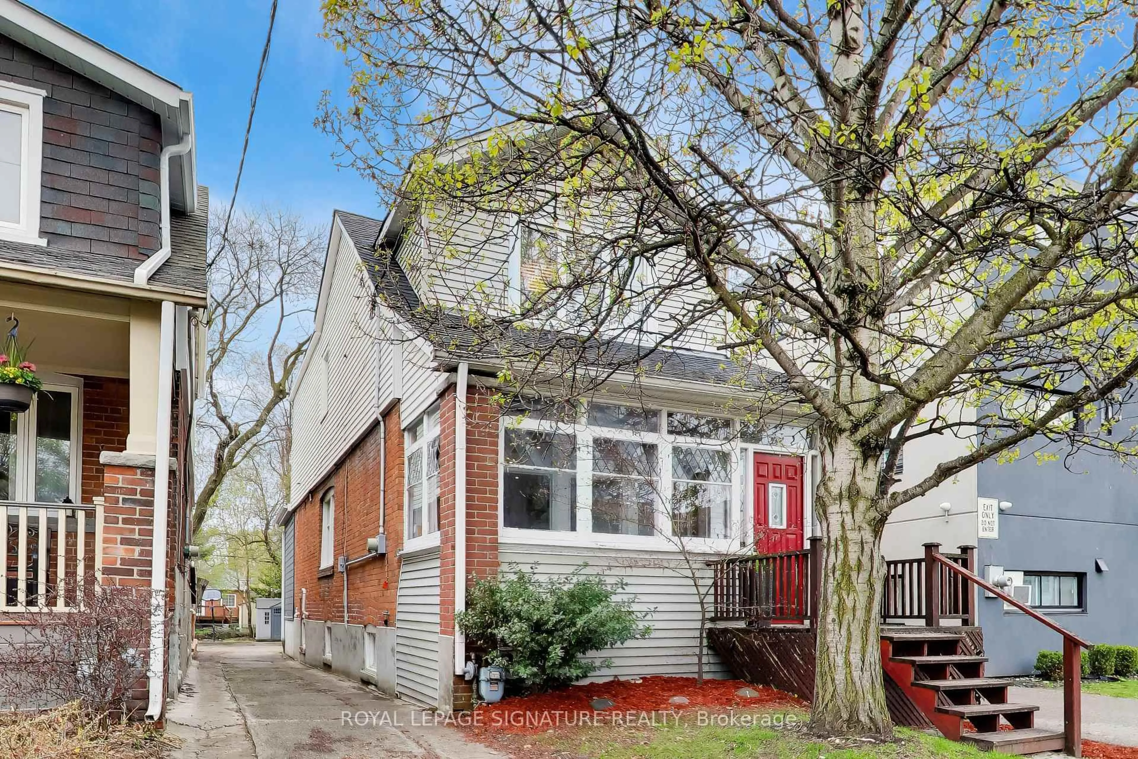 Home with brick exterior material, street for 259 Torrens Ave, Toronto Ontario M4J 2P6