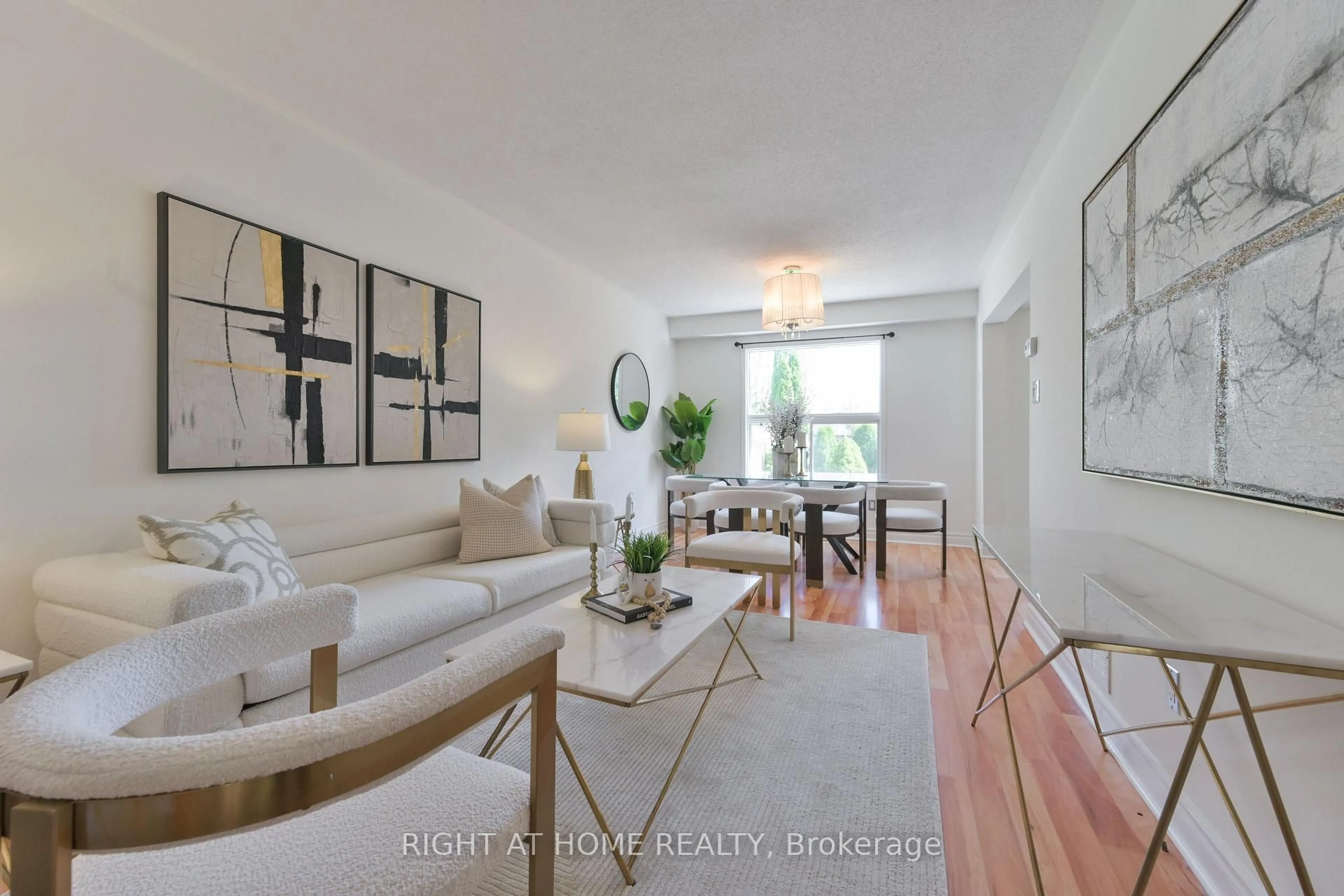 Living room with furniture, wood/laminate floor for 112 Creekwood Cres, Whitby Ontario L1R 2K4