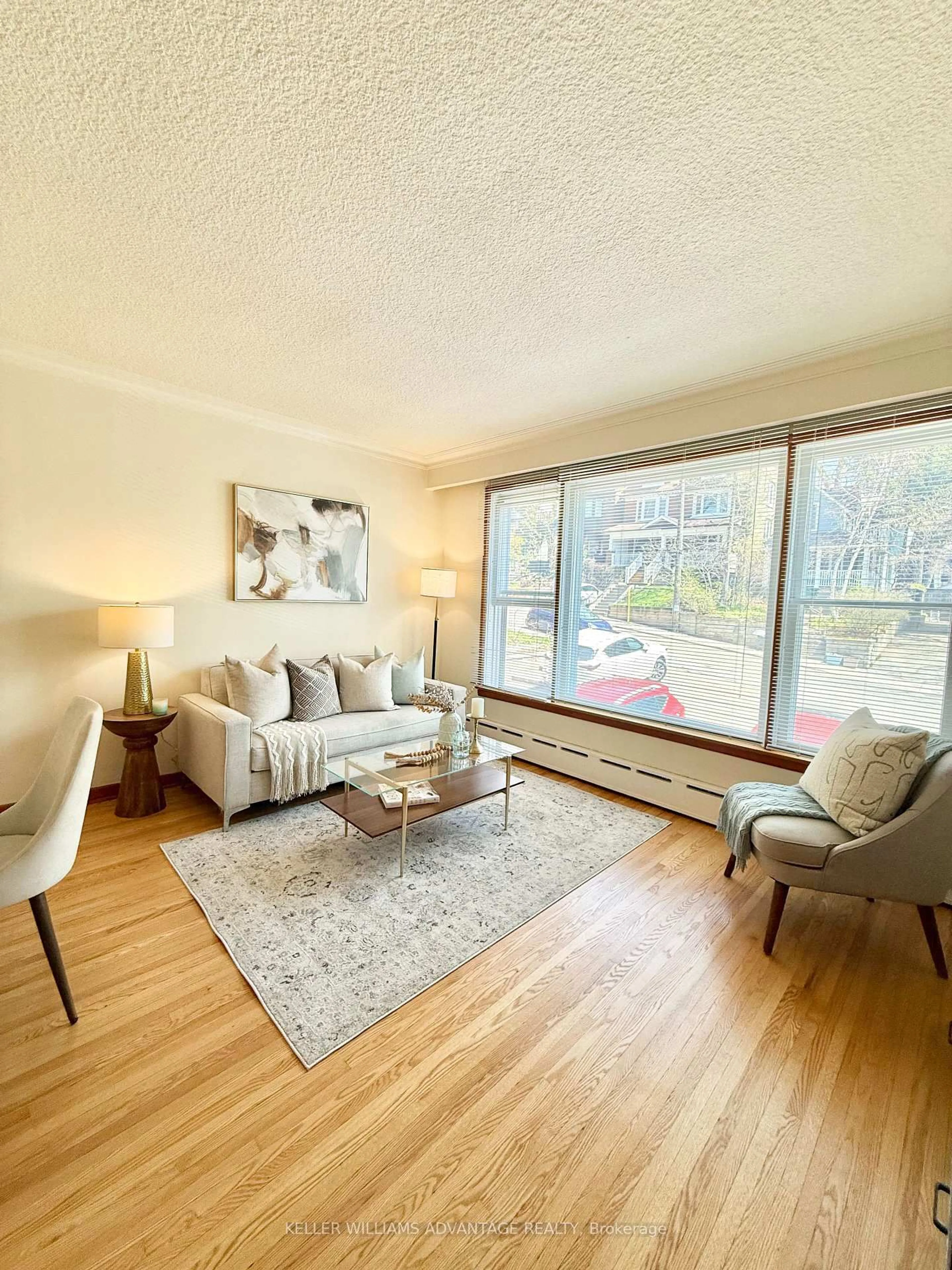 Living room with furniture, wood/laminate floor for 118 Silver Birch Ave, Toronto Ontario M4E 3L4