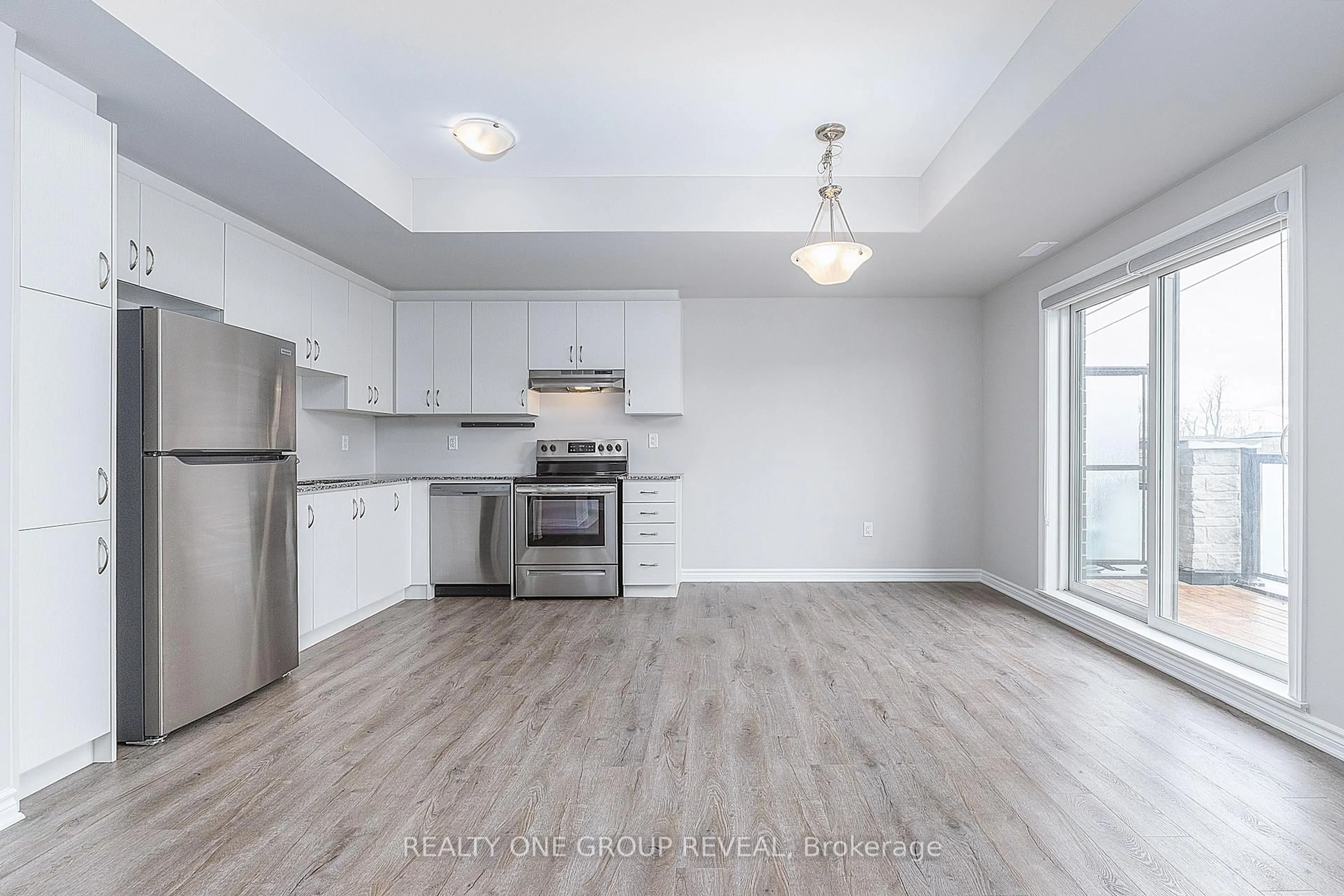 Open concept kitchen, wood/laminate floor for 616 1034 Reflection Pl, Pickering Ontario L1X 0L1