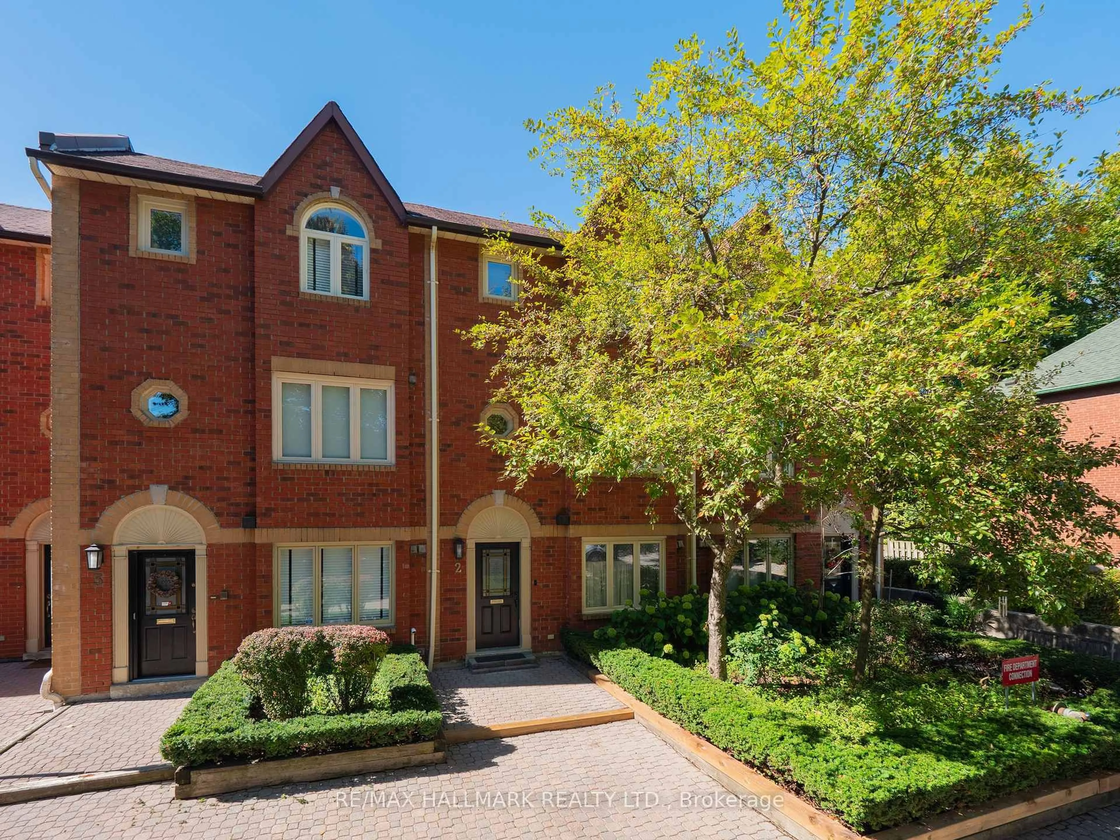Home with brick exterior material, street for 18 Doncrest Rd #TH #2, Toronto Ontario M4K 1R8