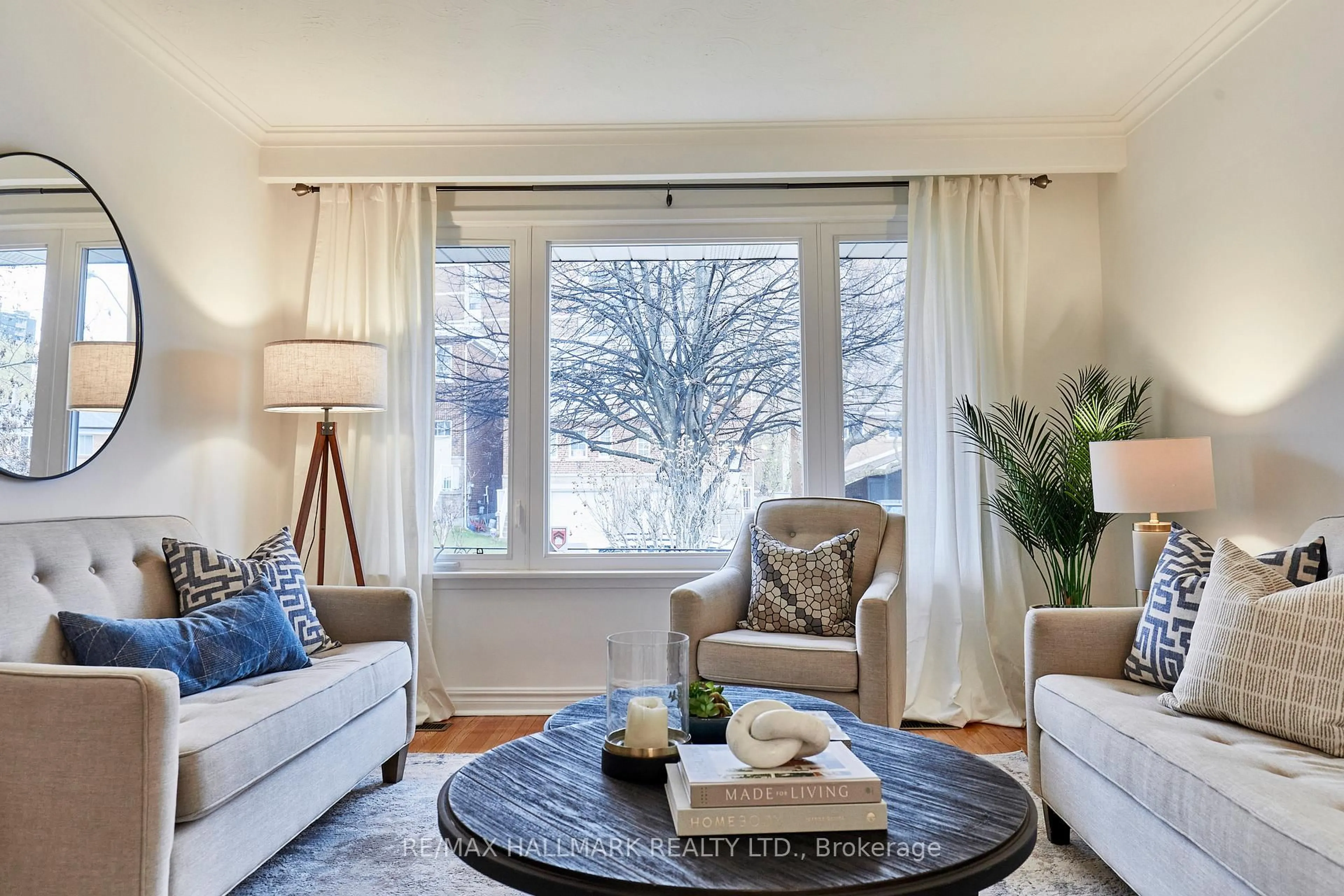 Living room with furniture, wood/laminate floor for 42 Halsey Ave, Toronto Ontario M4B 1A5