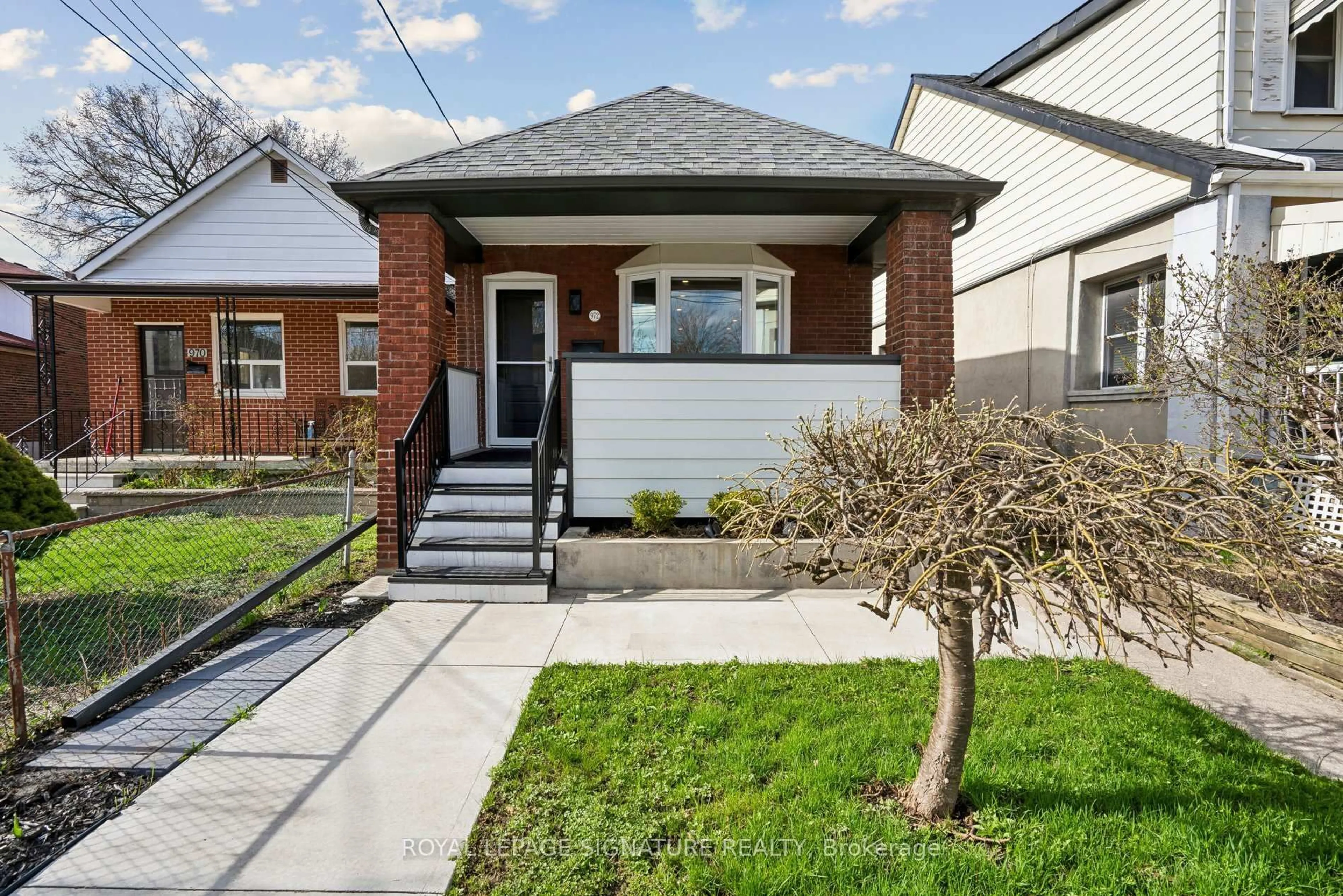 Home with brick exterior material, street for 972 Cosburn Ave, Toronto Ontario M4C 2W9