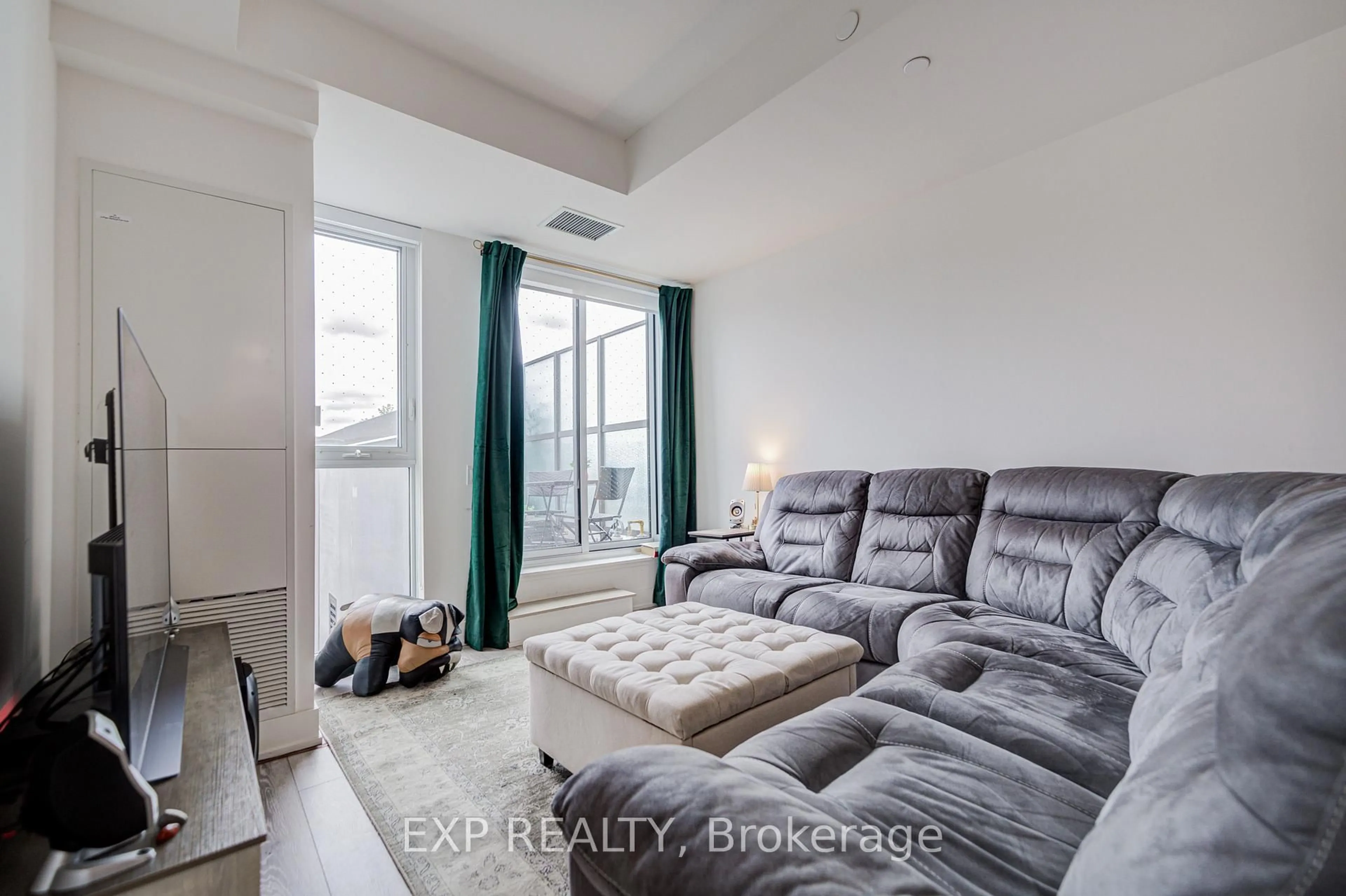 Living room with furniture, unknown for 1285 Queen St #211, Toronto Ontario M4L 1C2