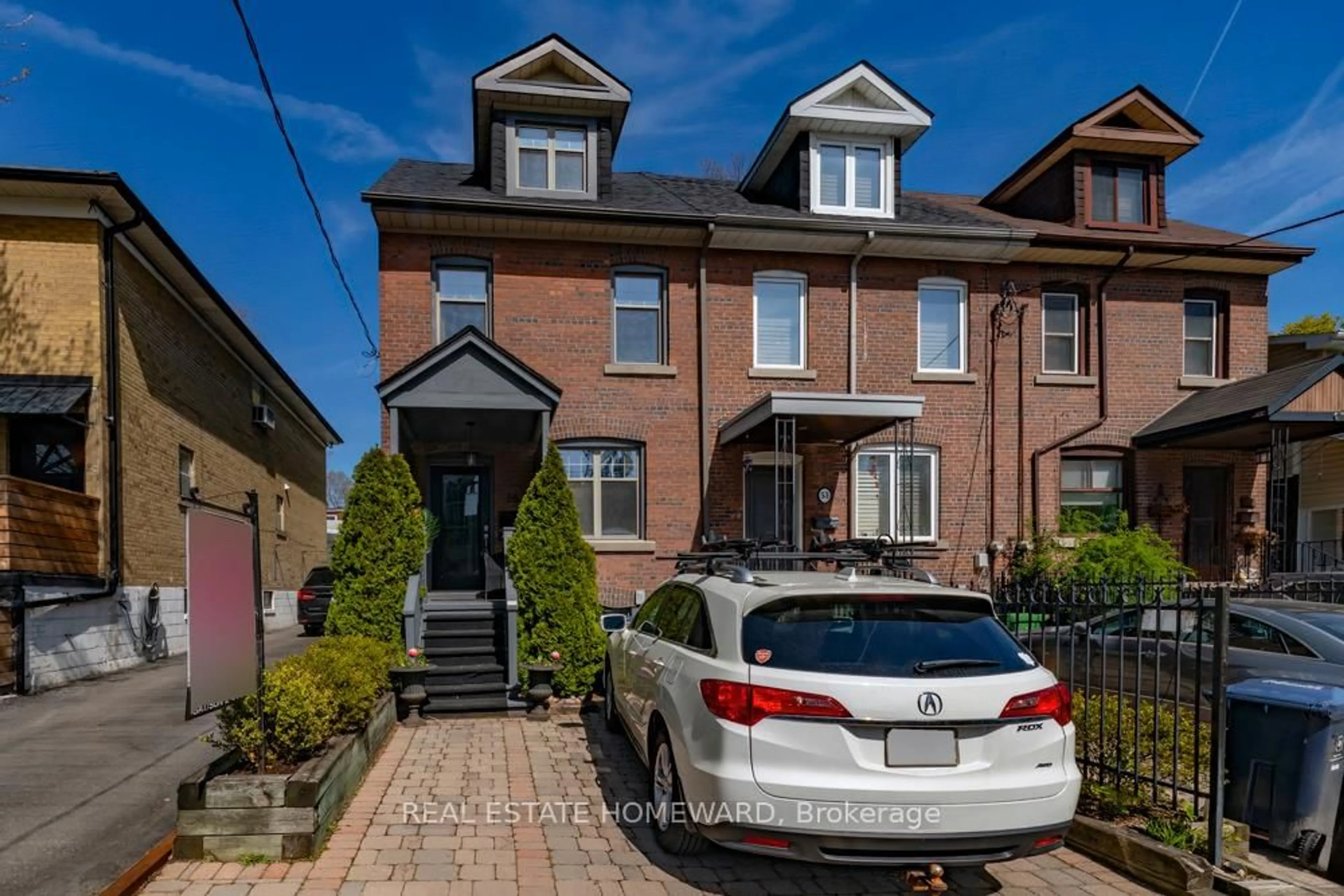 Home with brick exterior material, street for 55 Devon Rd, Toronto Ontario M4E 2J7