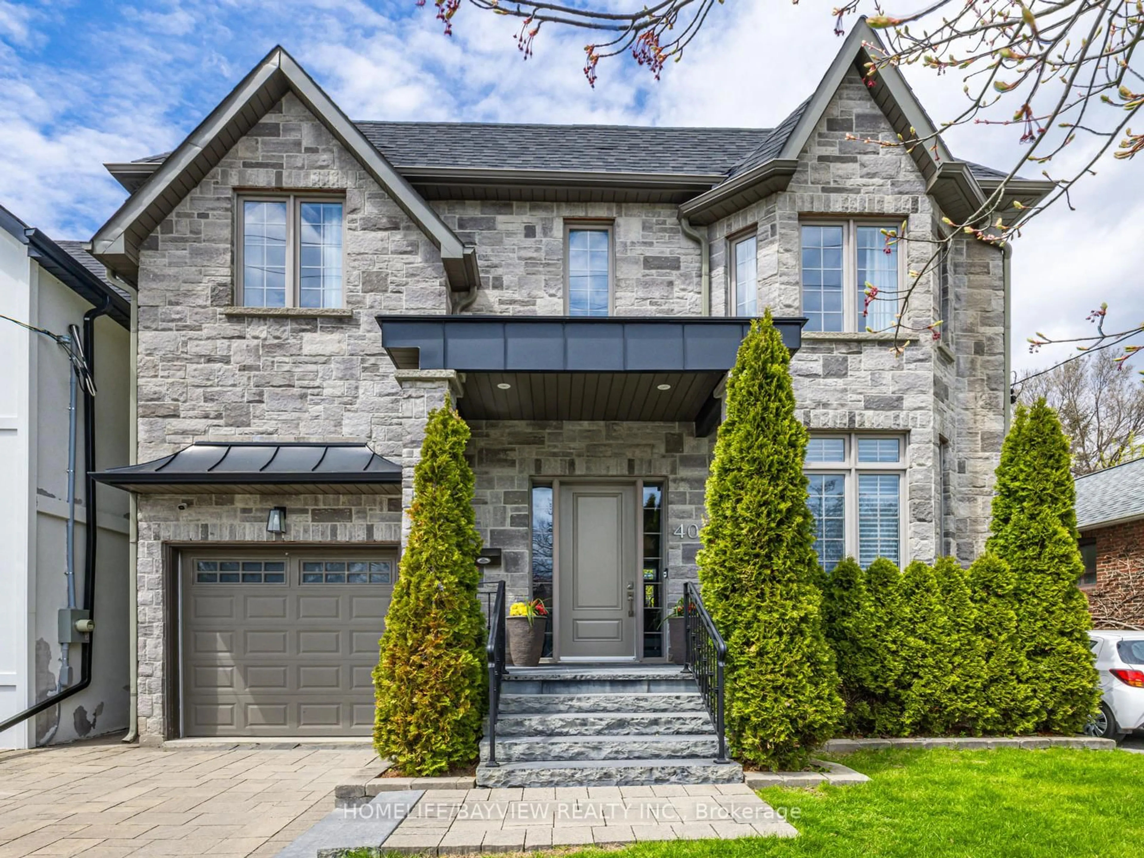 Home with brick exterior material, street for 40 Clonmore Dr, Toronto Ontario M1N 1X6