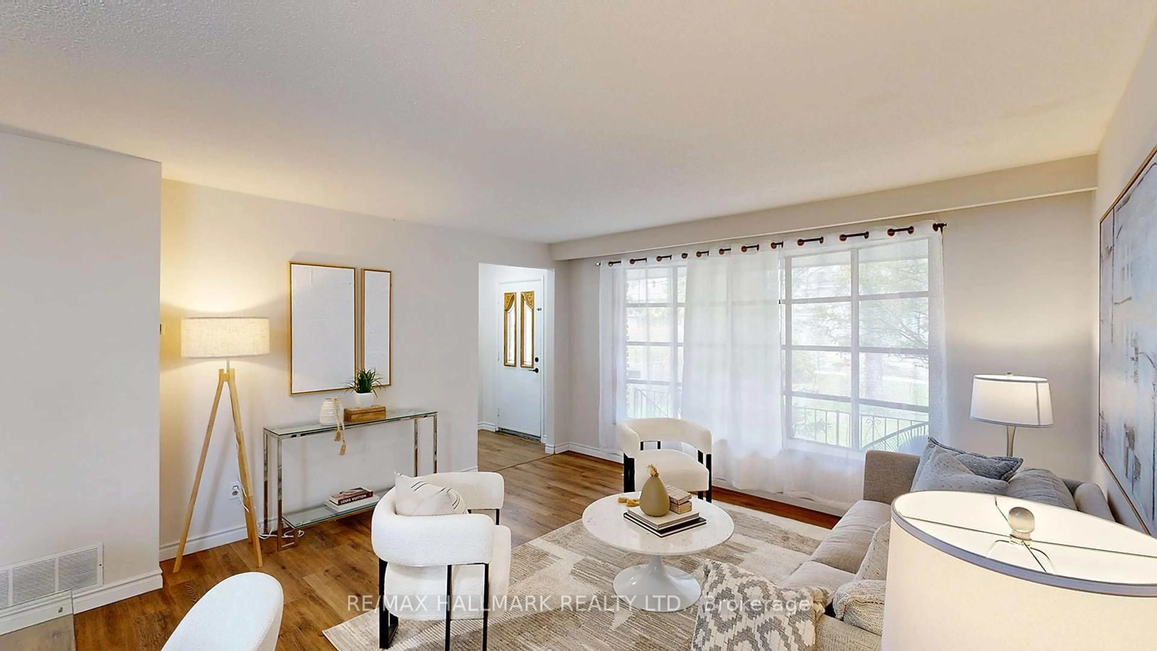 Living room with furniture, wood/laminate floor for 6197 Kingston Rd, Toronto Ontario M1C 1L1