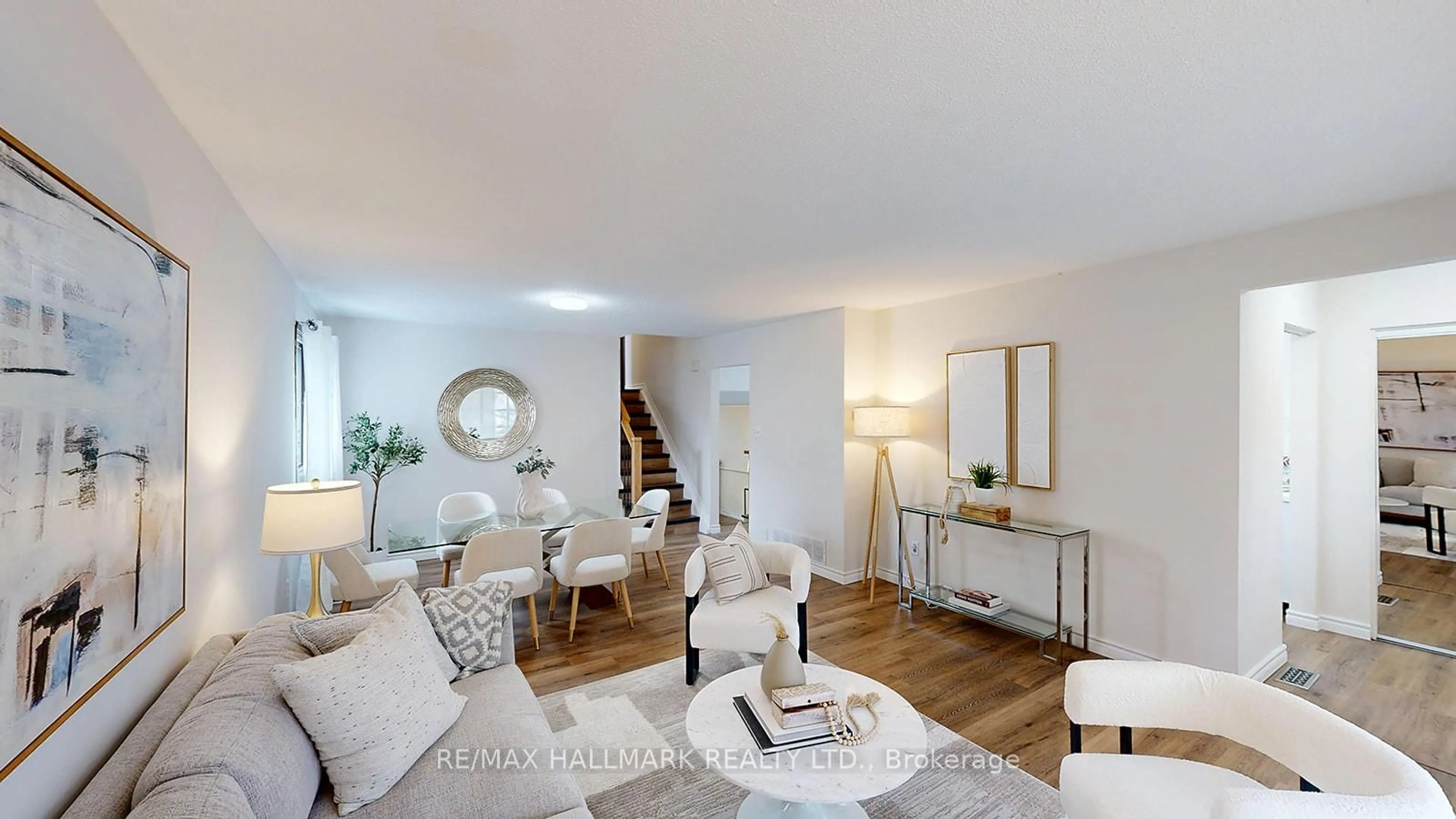 Living room with furniture, wood/laminate floor for 6197 Kingston Rd, Toronto Ontario M1C 1L1