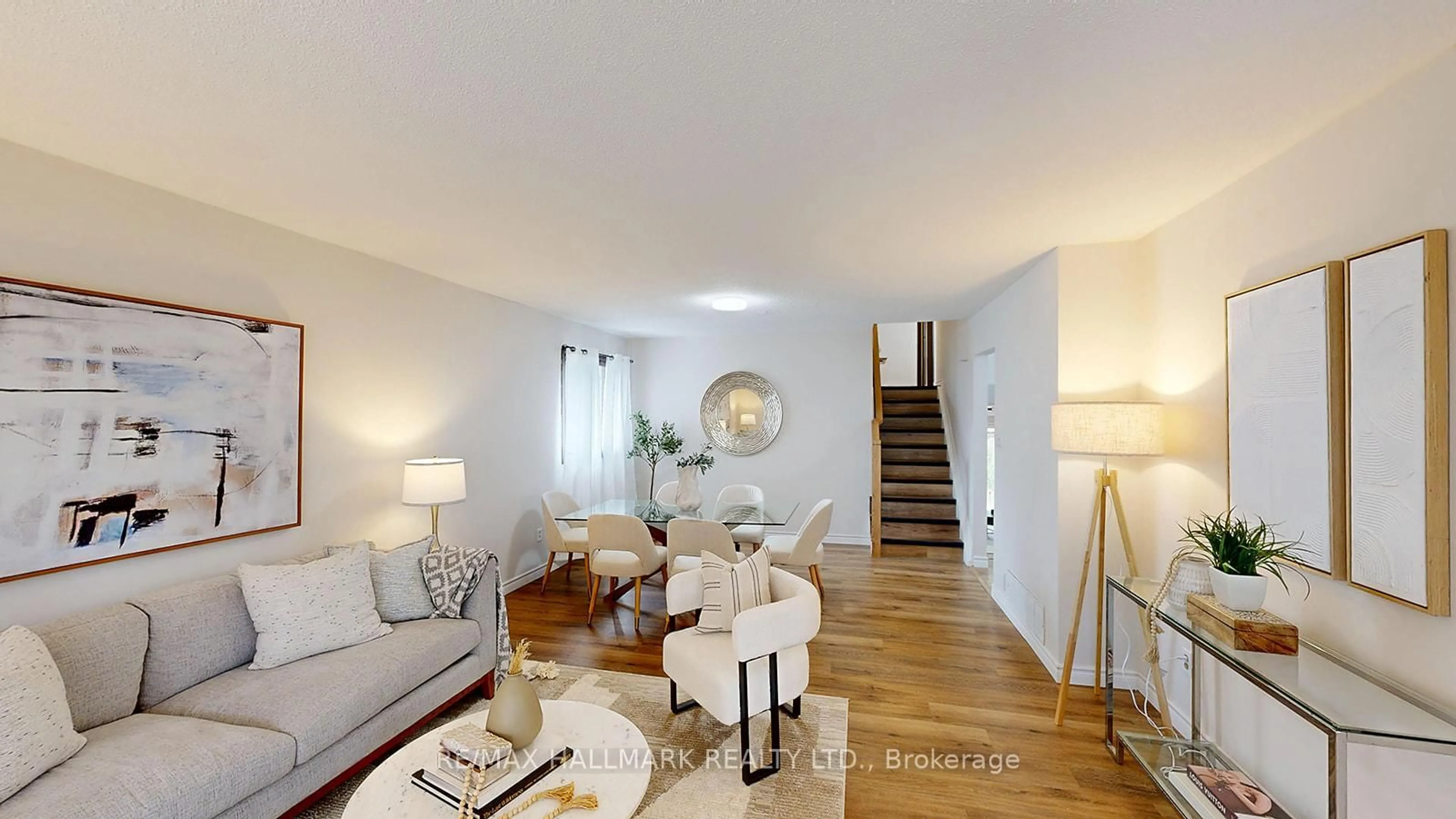Living room with furniture, wood/laminate floor for 6197 Kingston Rd, Toronto Ontario M1C 1L1