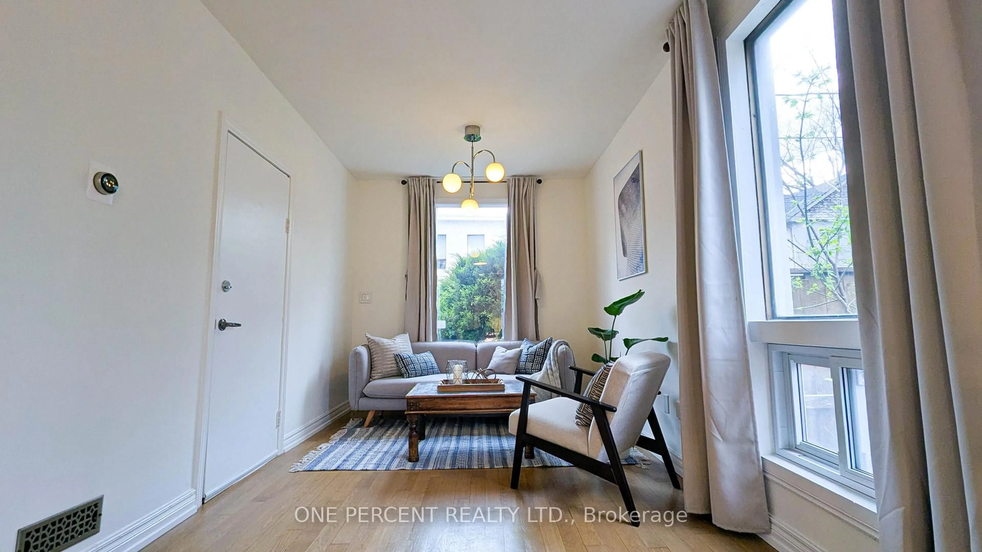 Living room with furniture, wood/laminate floor for 119 De Grassi St, Toronto Ontario M4M 2K5