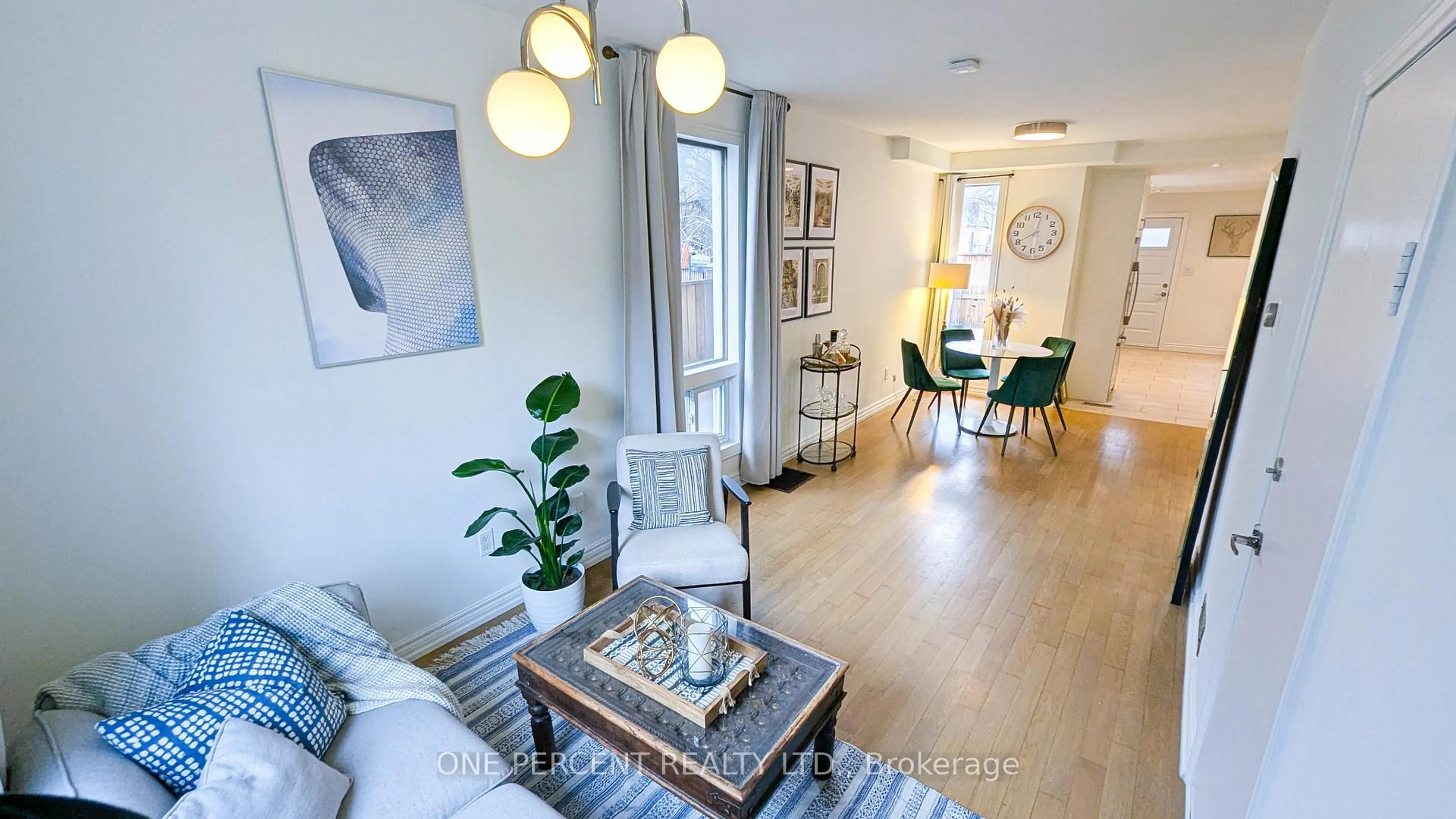 Living room with furniture, wood/laminate floor for 119 De Grassi St, Toronto Ontario M4M 2K5
