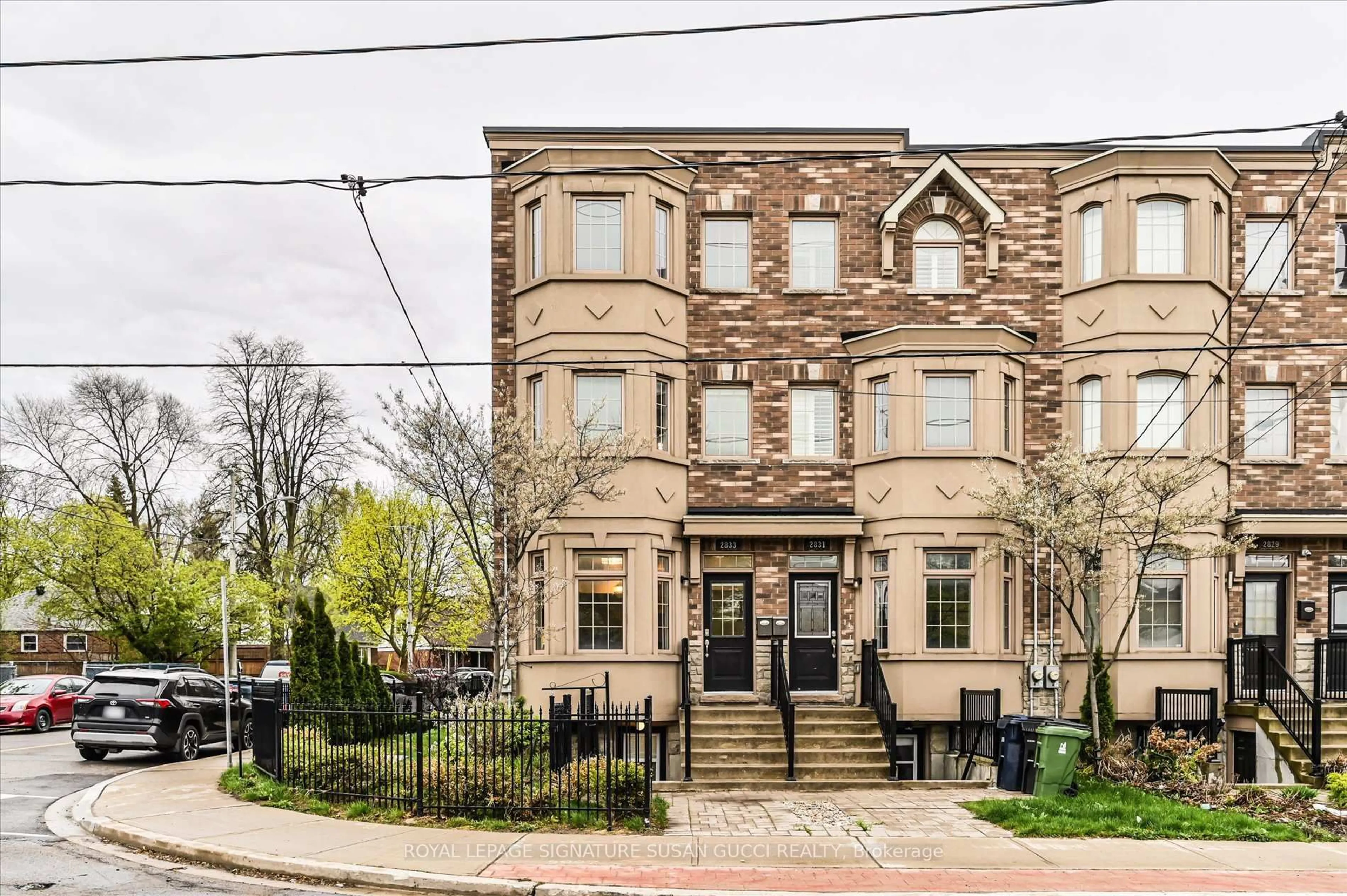 Home with brick exterior material, street for 2833 St. Clair Ave, Toronto Ontario M4B 1N3