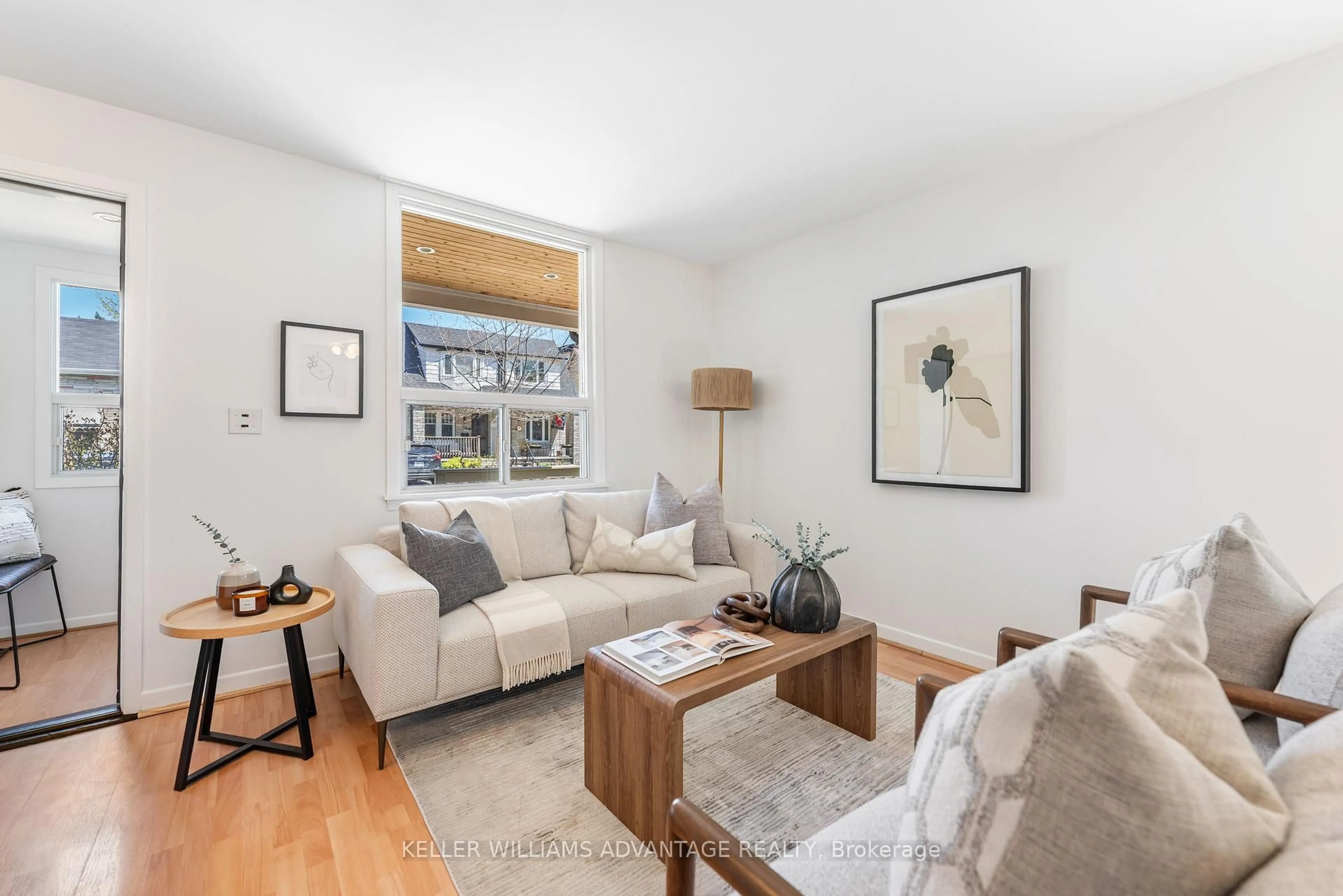Living room with furniture, wood/laminate floor for 60 Wayland Ave, Toronto Ontario M4E 3C9