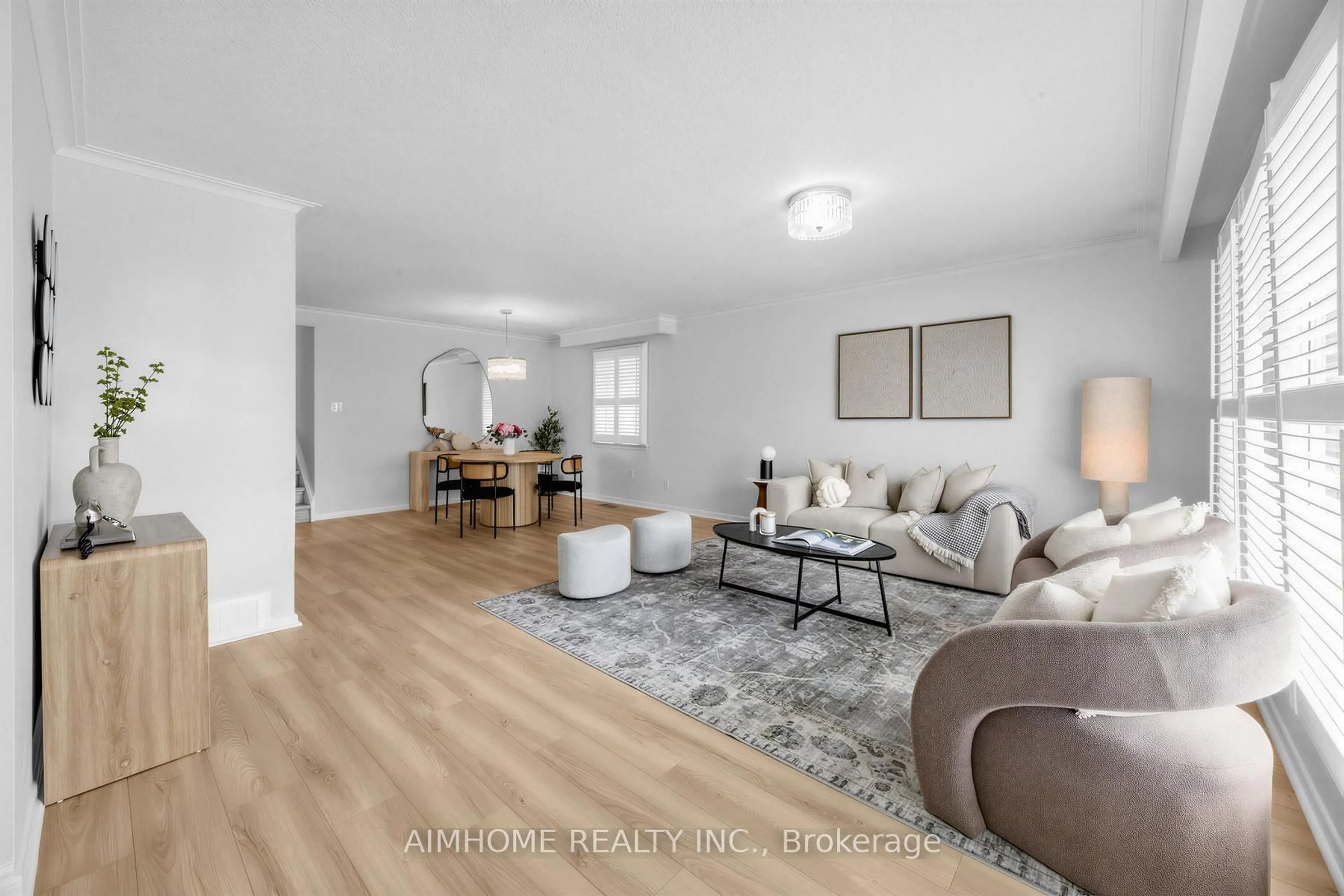 Living room with furniture, wood/laminate floor for 34 Marilake Dr, Toronto Ontario M1S 1V7