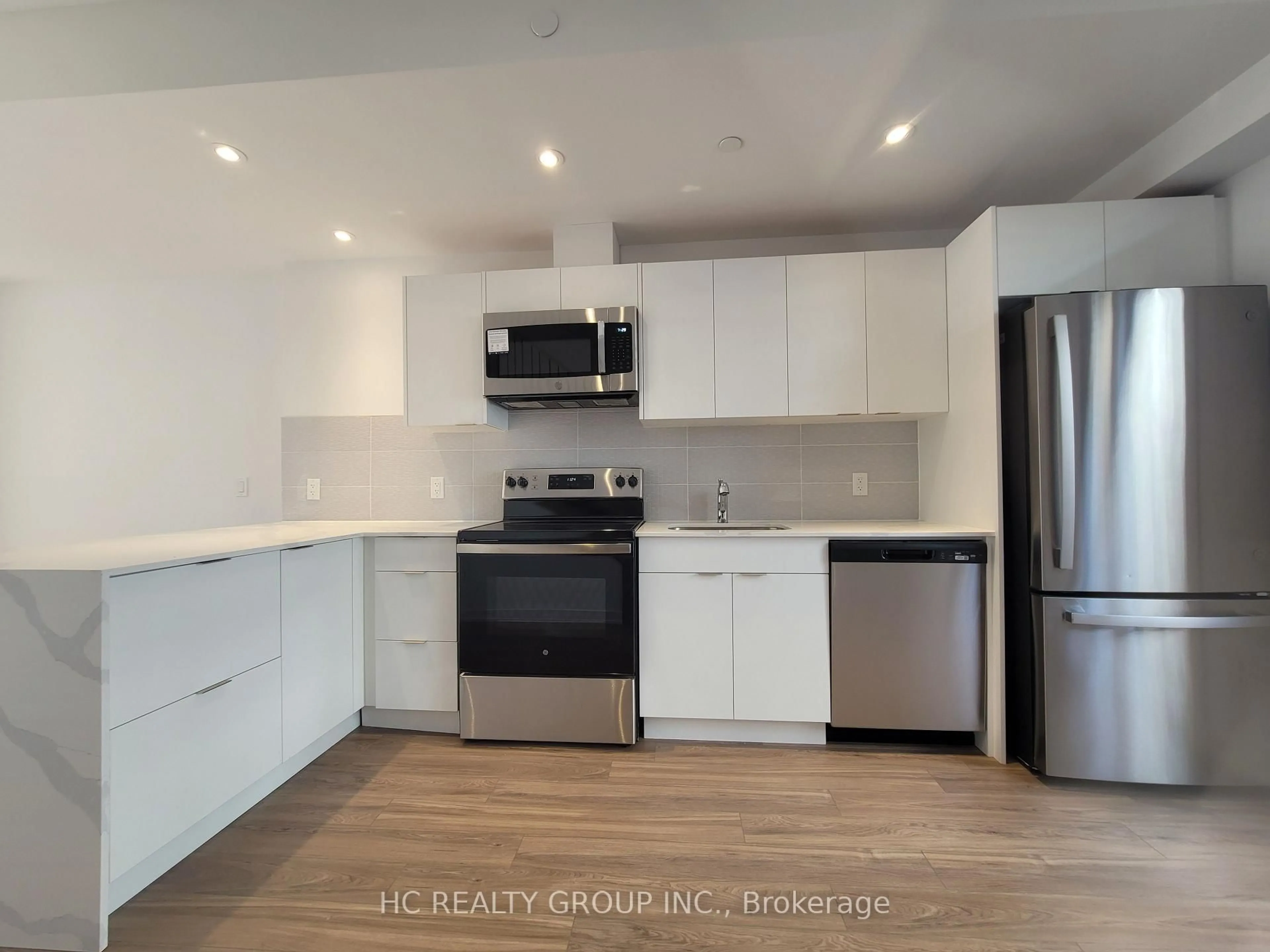 Open concept kitchen, wood/laminate floor for 11 Calamint Lane, Toronto Ontario M1W 2H1