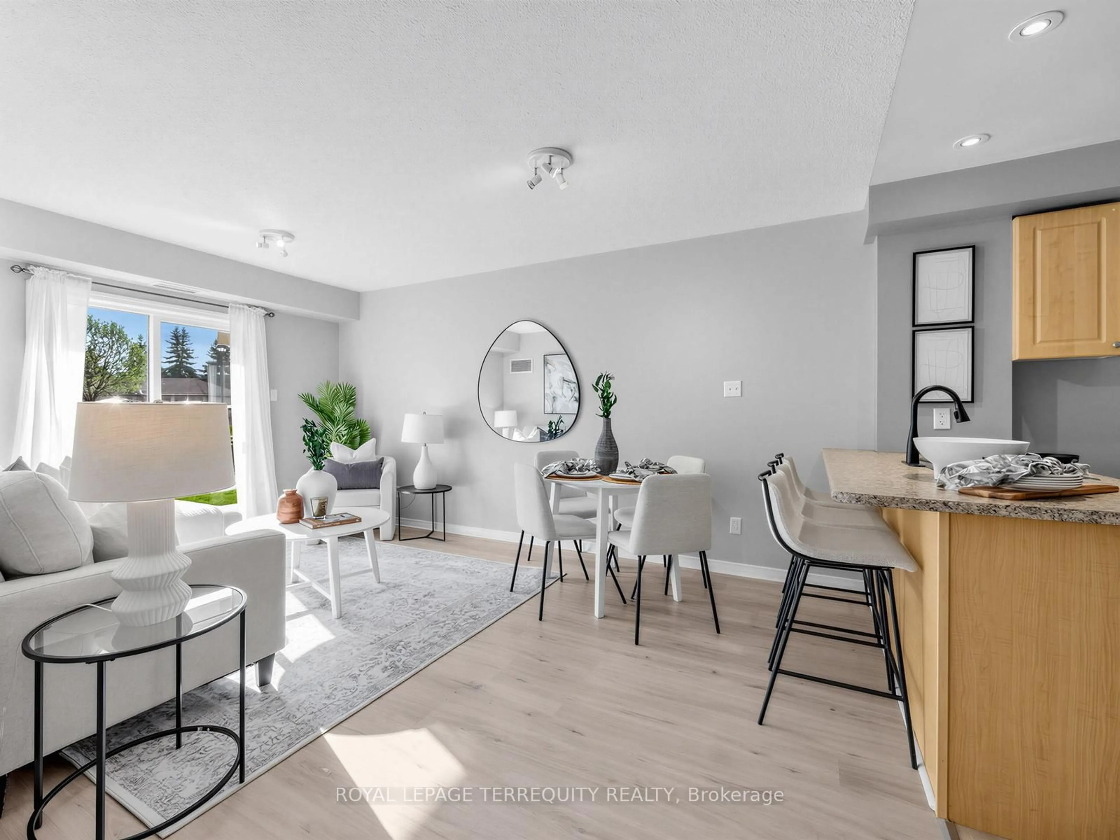 Open concept kitchen, wood/laminate floor for 124 Aspen Springs Dr #102, Clarington Ontario L1C 0G8
