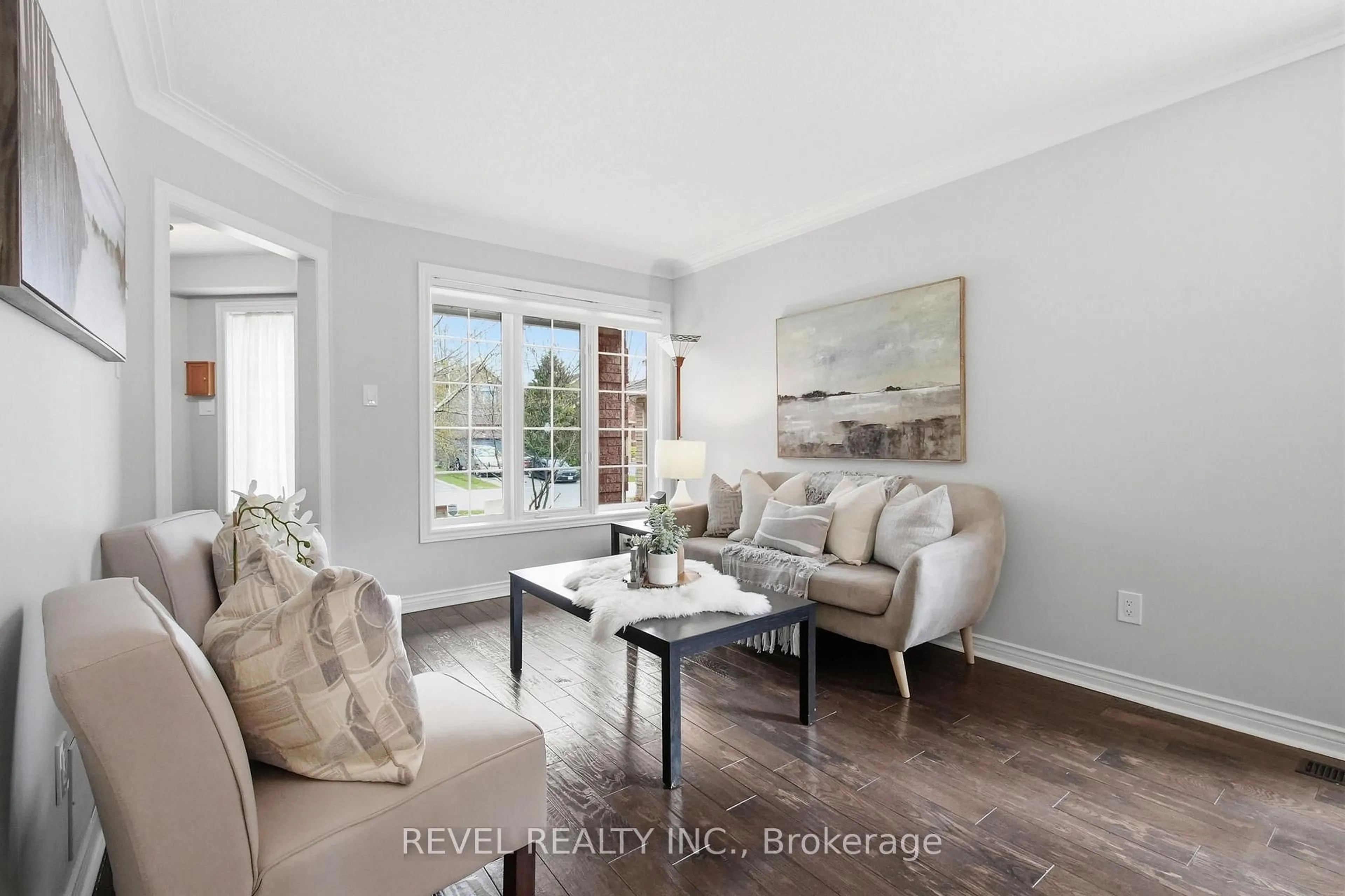 Living room with furniture, wood/laminate floor for 68 Parnell Cres, Whitby Ontario L1R 2L5