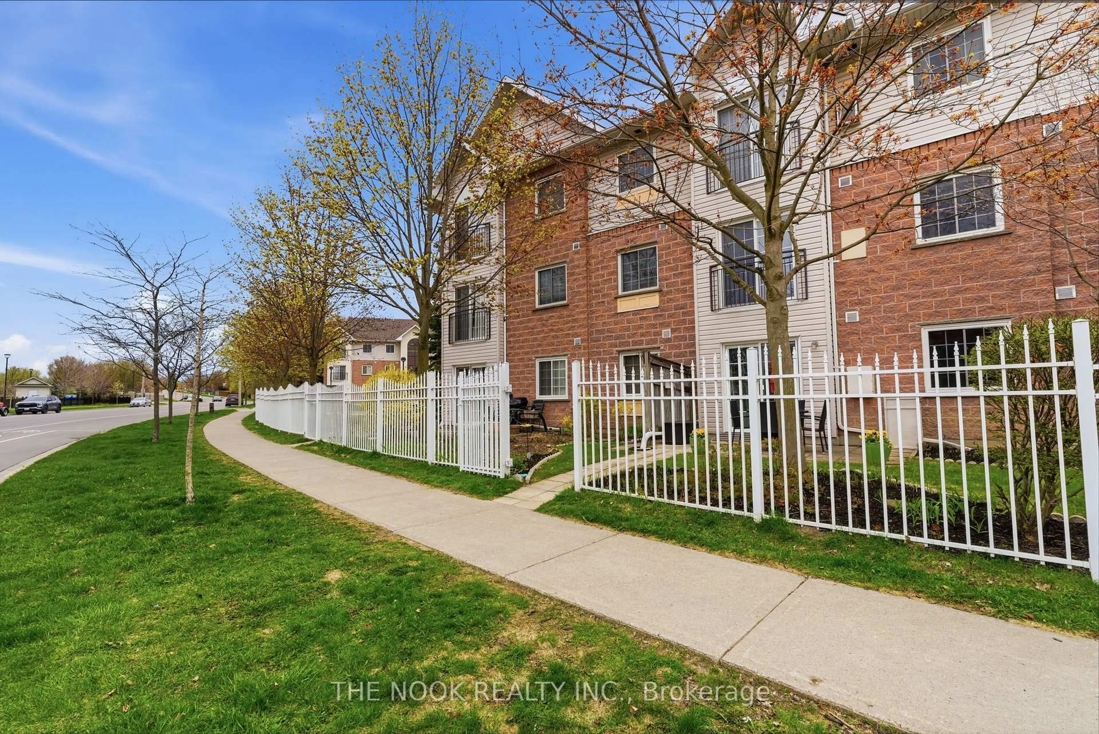 A pic from outside/outdoor area/front of a property/back of a property/a pic from drone, street for 91 Aspen Springs Dr #107, Clarington Ontario L1C 5J9