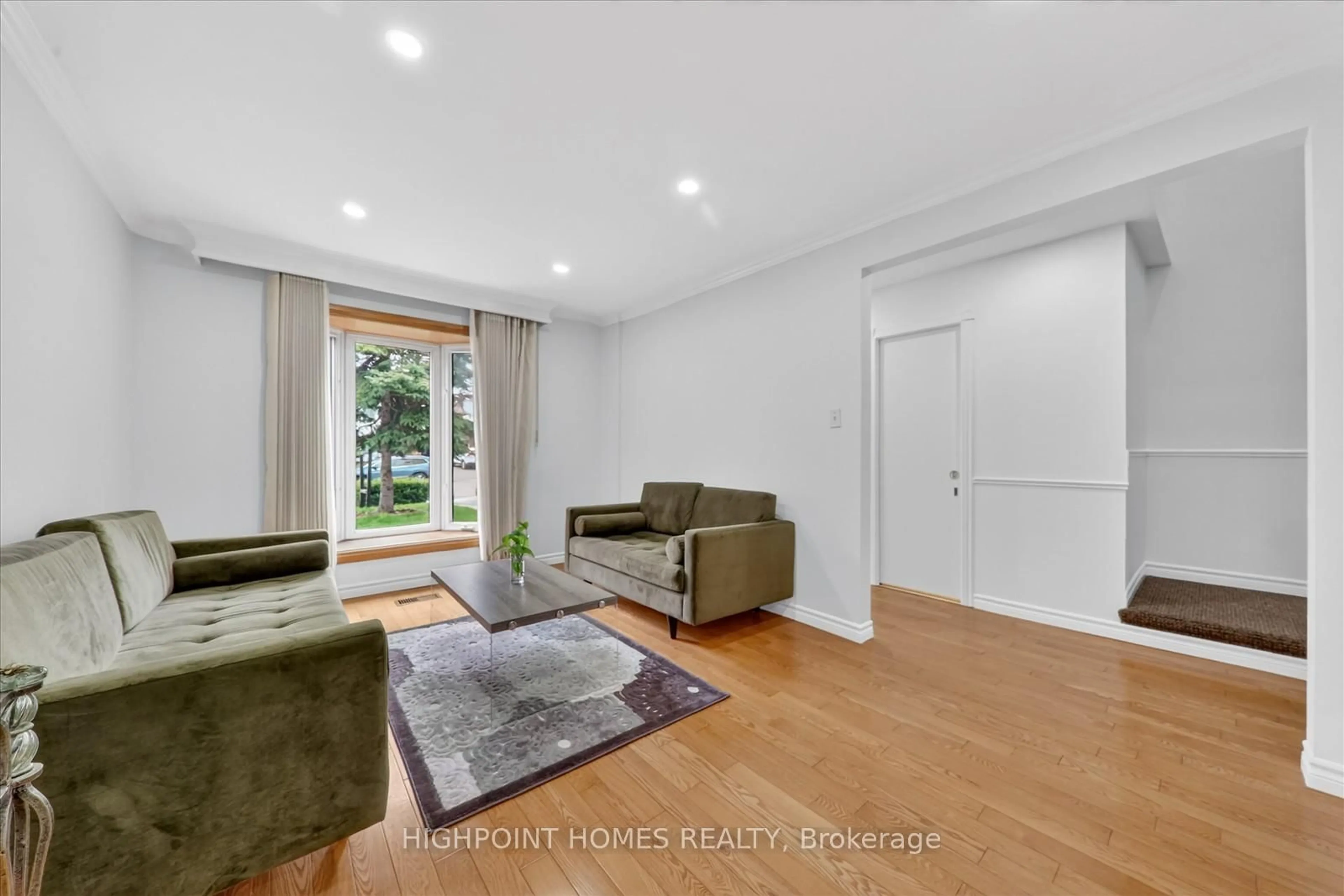 Living room with furniture, wood/laminate floor for 16 Fearn Cres, Ajax Ontario L1S 5L6