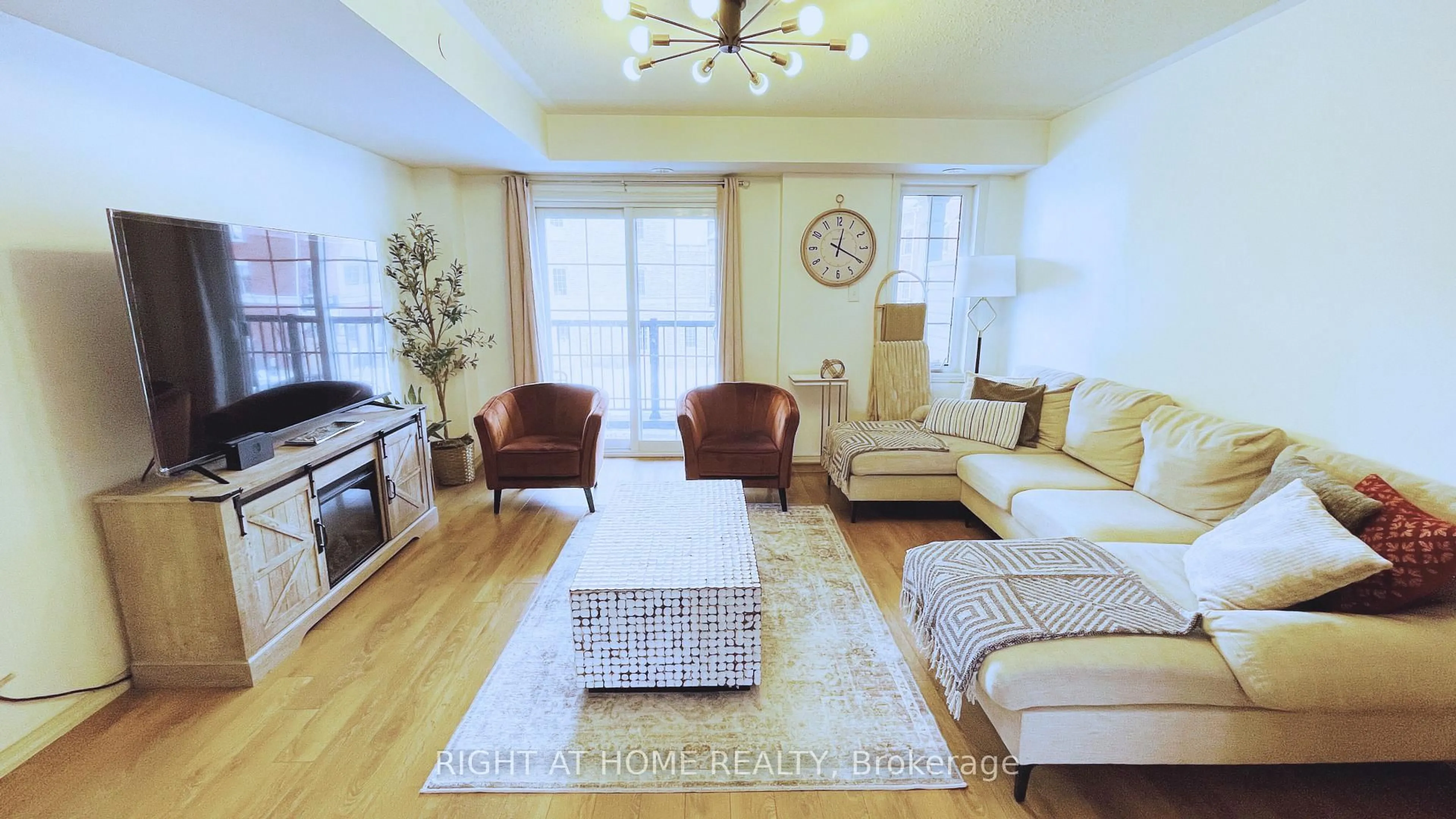 Living room with furniture, wood/laminate floor for 2372 Chevron Prince Path, Oshawa Ontario L1L 0K9