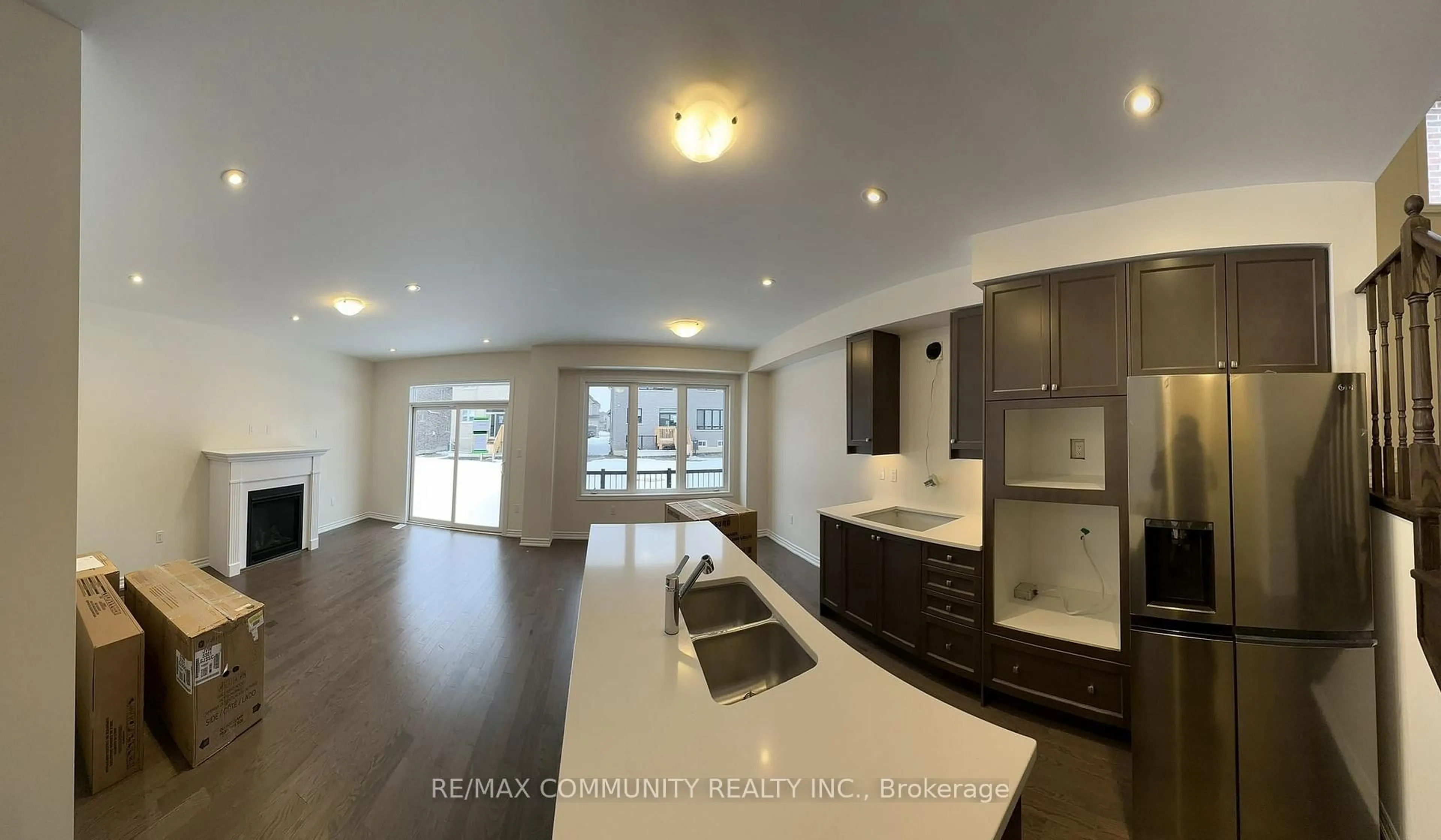 Open concept kitchen, wood/laminate floor for 59 Mountainside Cres, Whitby Ontario L1R 0P4