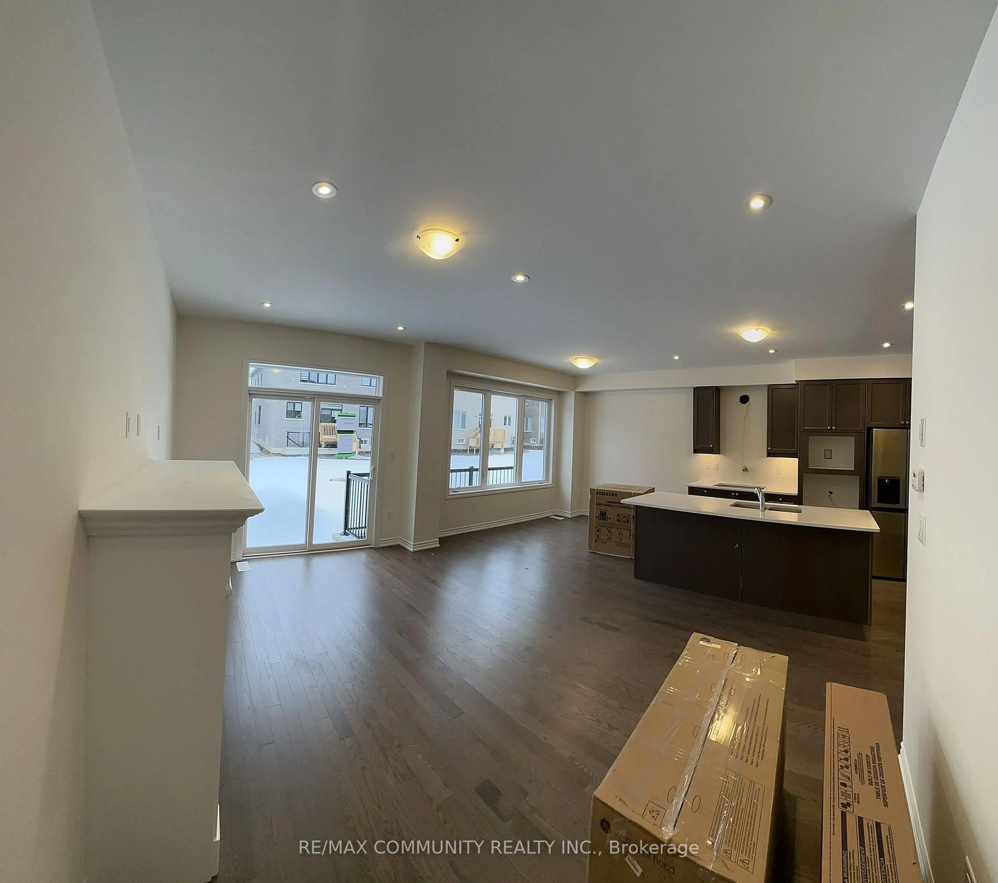 Open concept kitchen, wood/laminate floor for 59 Mountainside Cres, Whitby Ontario L1R 0P4