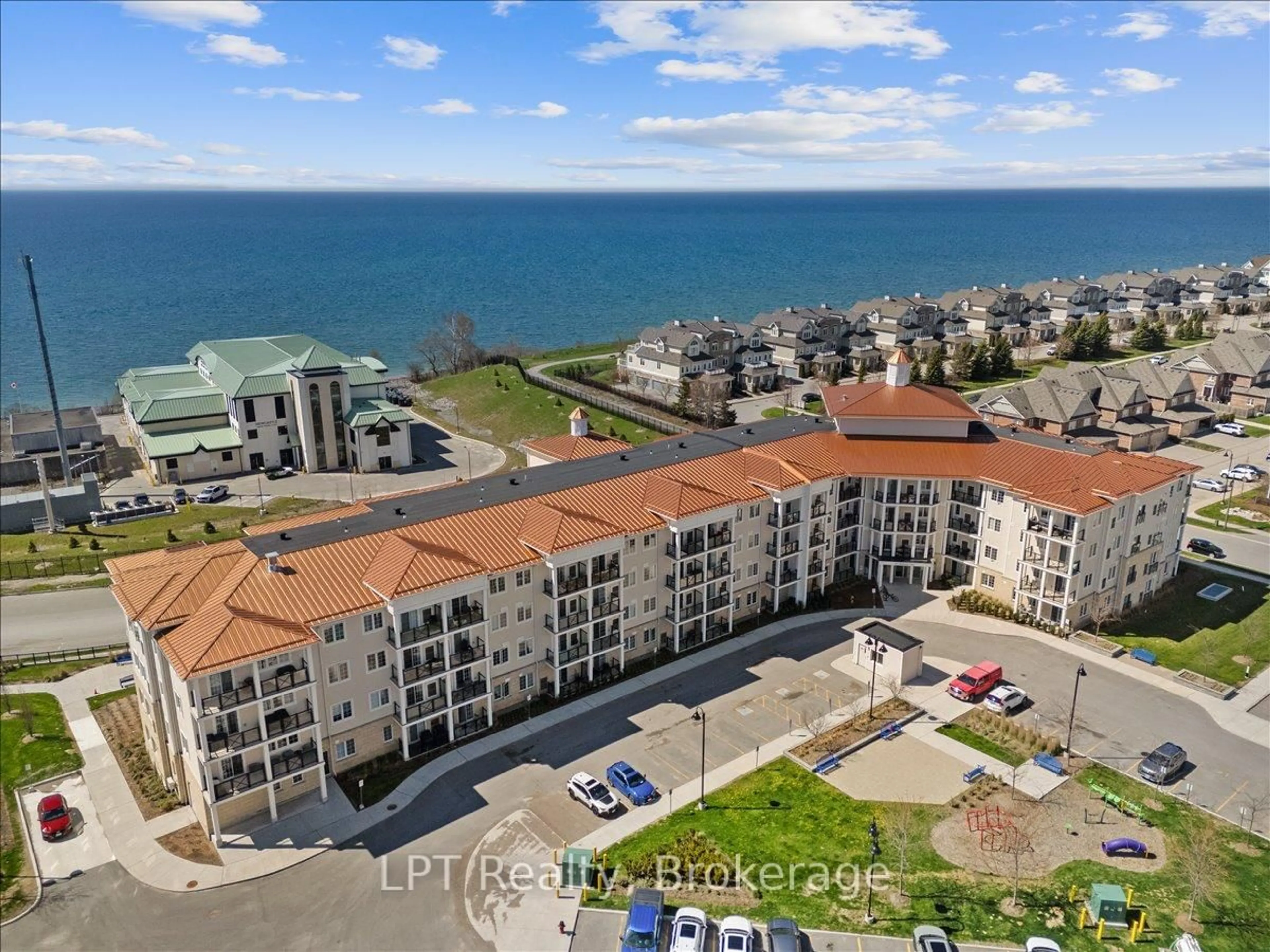 A pic from outside/outdoor area/front of a property/back of a property/a pic from drone, water/lake/river/ocean view for 50 Lakebreeze Dr #102, Clarington Ontario L1B 0V9
